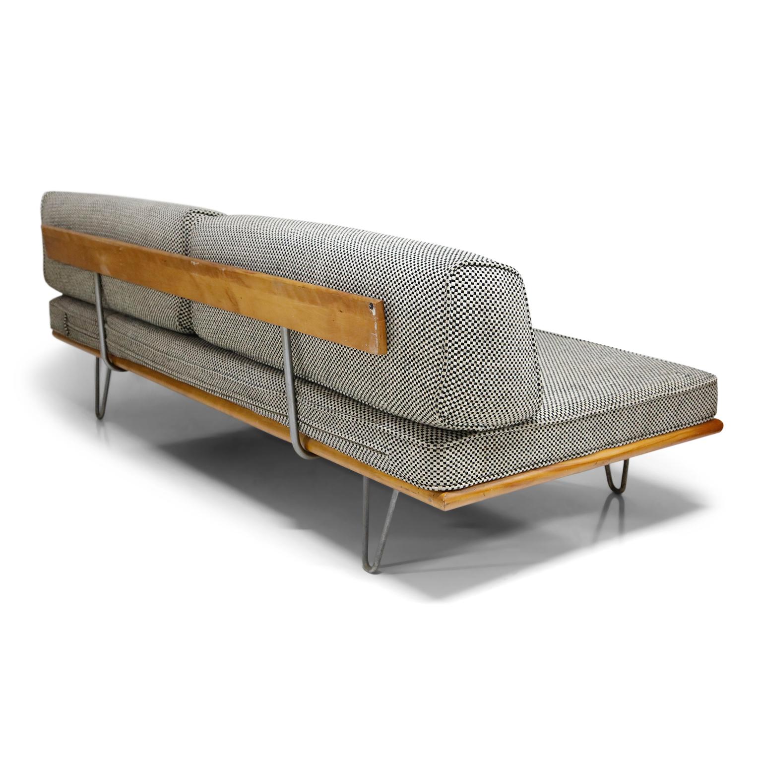 This incredible highly collectible Mid-Century Modern convertible daybed sofa was designed by George Nelson and manufactured by Herman Miller, circa 1950s. Ingenious design allows this to be used as a sofa and then when needed, removing the back