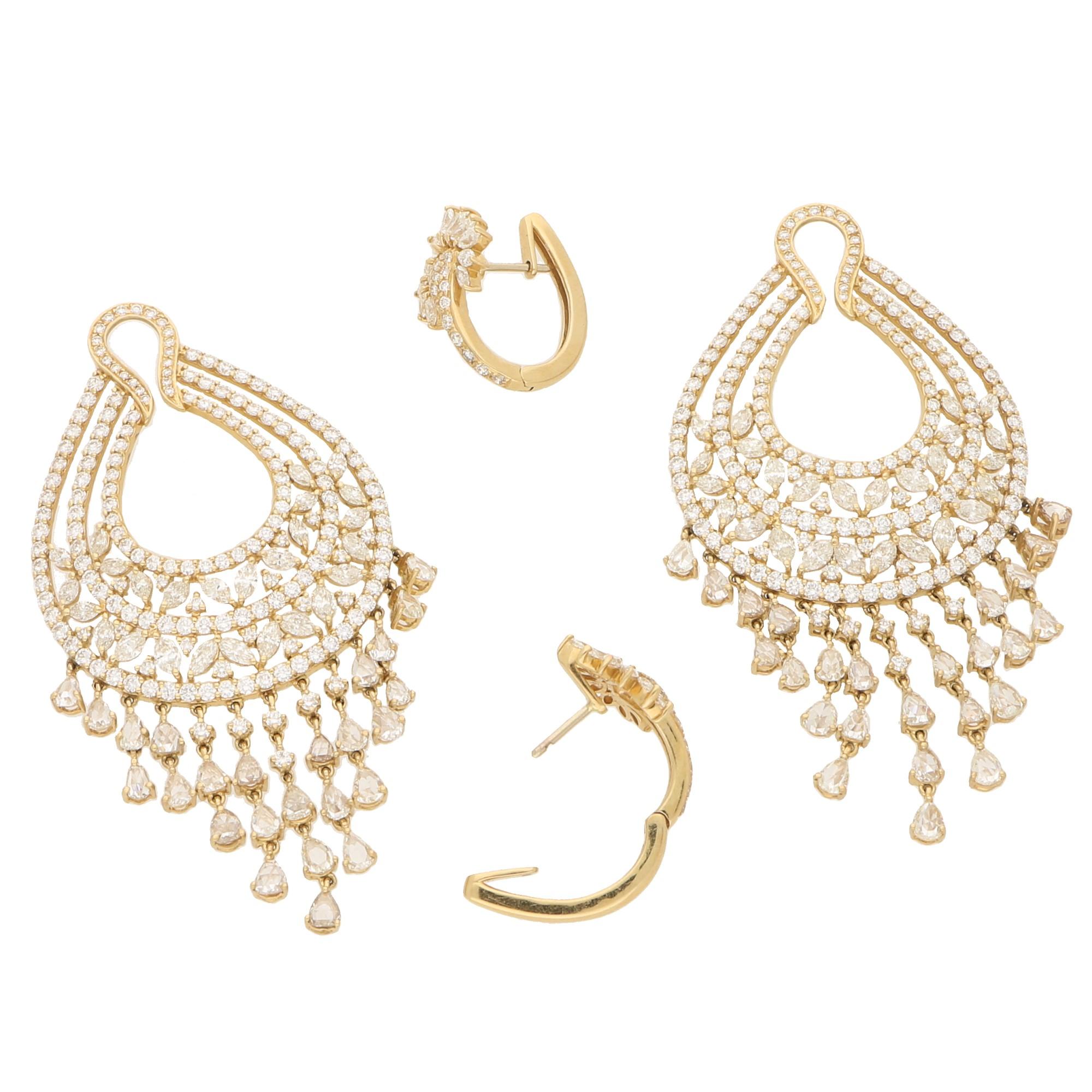 A gorgeous pair of convertible diamond chandelier tassel earrings set in 18 karat yellow gold. 

Each earring is composed of a lotus motif diamond hoop, from which hangs an openwork drop set with marquise brilliant-cut and round brilliant-cut