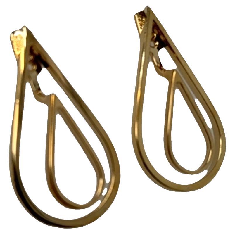 Two looks. One stunning pair.
These versatile 14k yellow gold earrings transform effortlessly to match your mood or moment. Wear them with the elegant double teardrop design for a bold, graceful statement—or remove the inner piece for a sleek,
