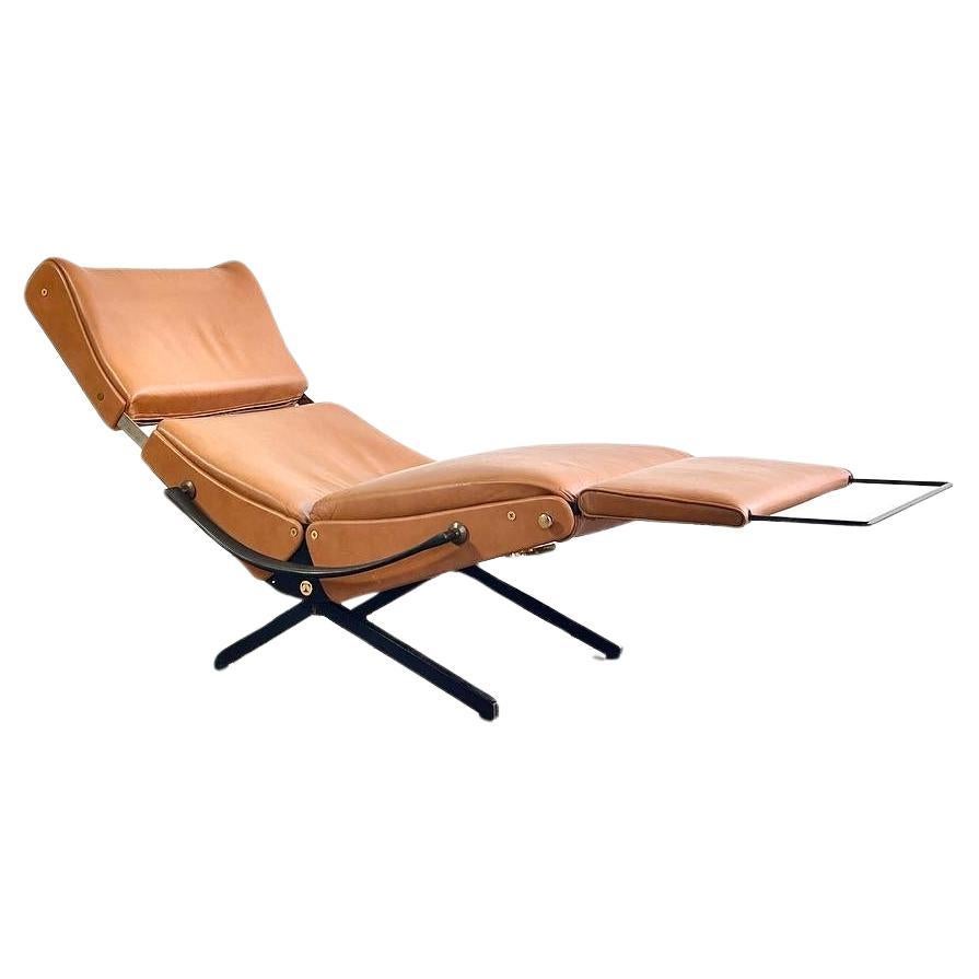 Italian modern TECNO P40 convertible lounge chair

designed by Osvaldo Borsani in 1954

beautiful 1960ies edition cognac-brown leather. 

Second edition of the P40 lounge chair, with height adjustable back rest, manufactured by Tecno, in Italy ca.