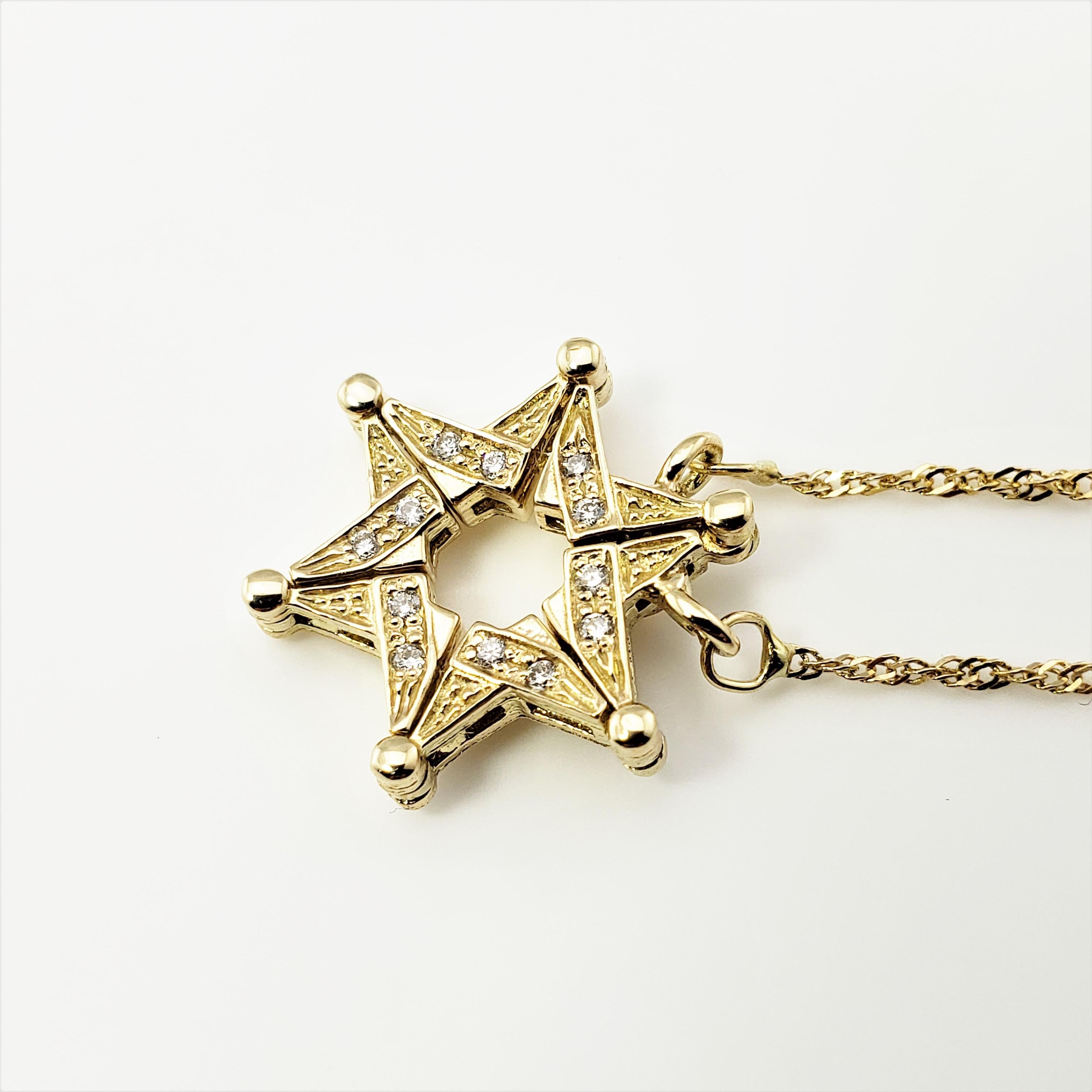 Convertible Magnetic 14 Karat Yellow Gold and Diamond Star of David Pendant Necklace-

This lovely convertible magnetic pendant features the Star of David accented with 12 round brilliant cut diamonds set in 14K yellow gold.  Suspended from a