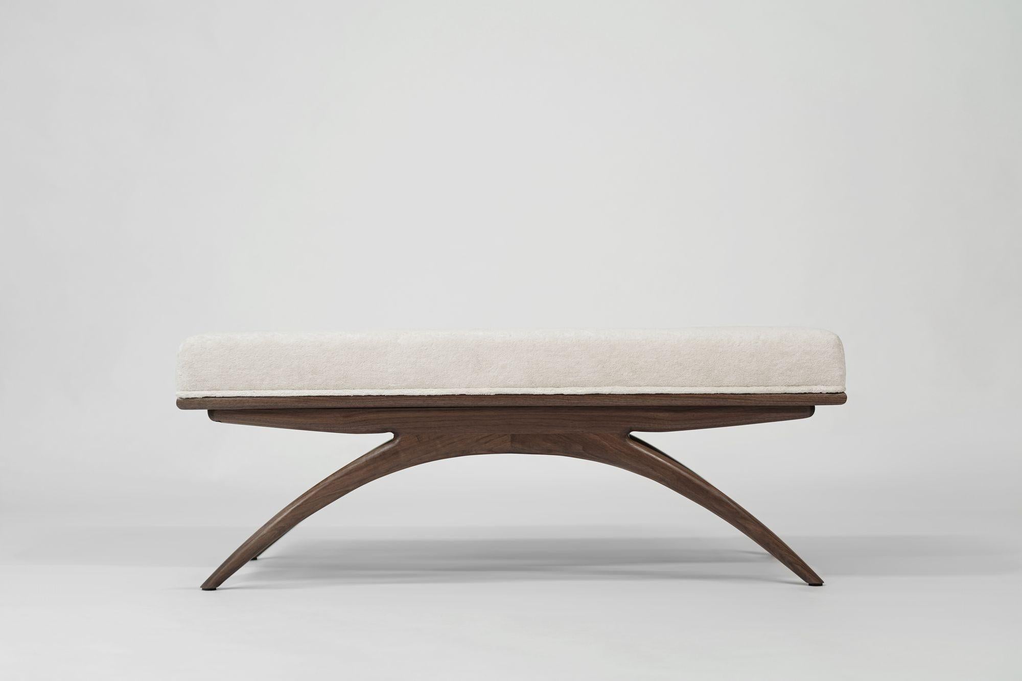 Introducing the Convex Bench by Carlos Solano for Stamford Modern—an exquisite blend of timeless craftsmanship and lightweight design. Meticulously crafted from solid oak or walnut, this bench exudes sophistication, making it a perfect complement to