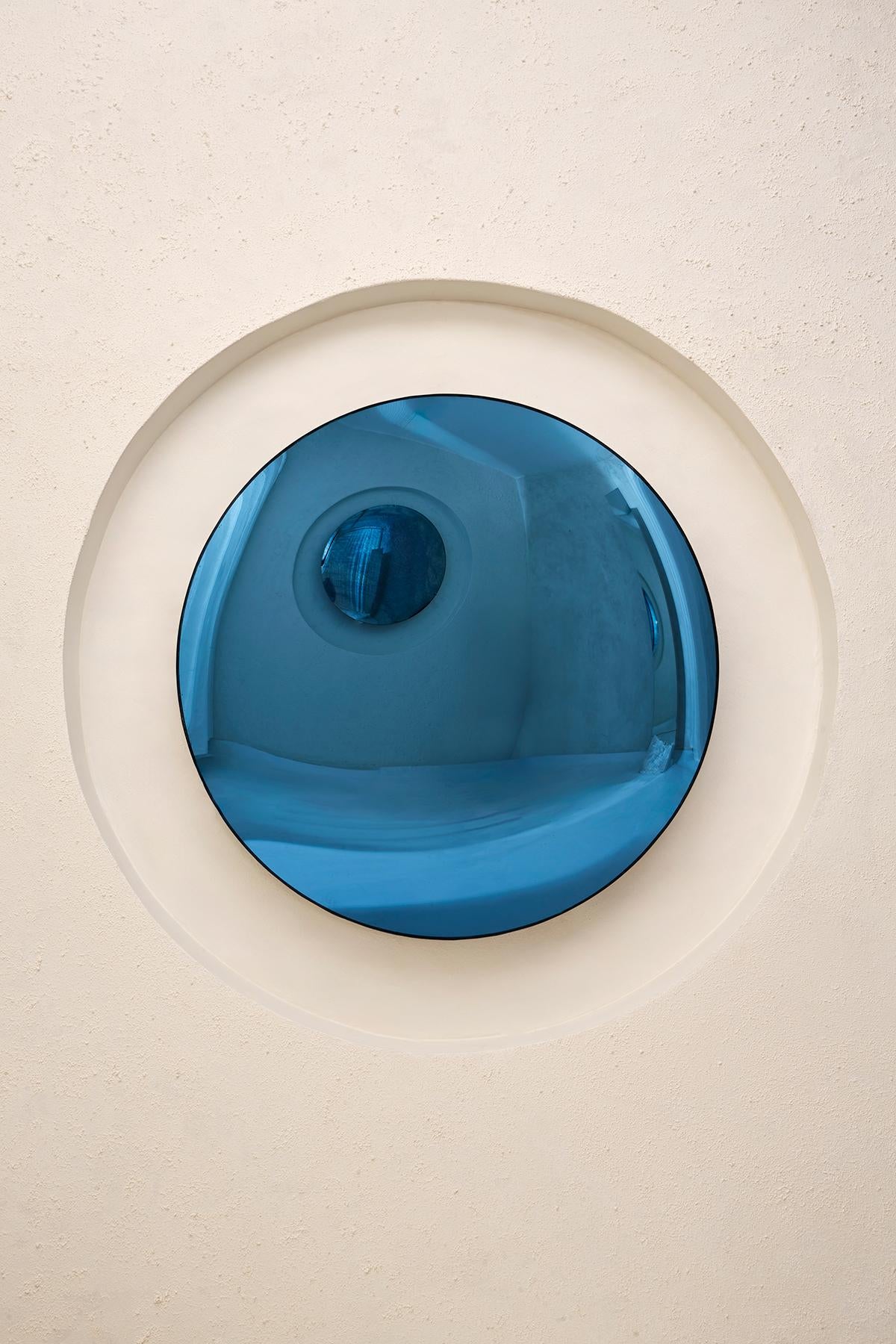 Convex Dark Blue Mirror by Homa
Dimensions: D 97 x H 7 cm
Materials: Convex Oxidized Mirror. 

HOMA is a contemporary design atelier based in Istanbul. The atelier’s trademark processes are handblown glass, glass fusing and mirroring, created