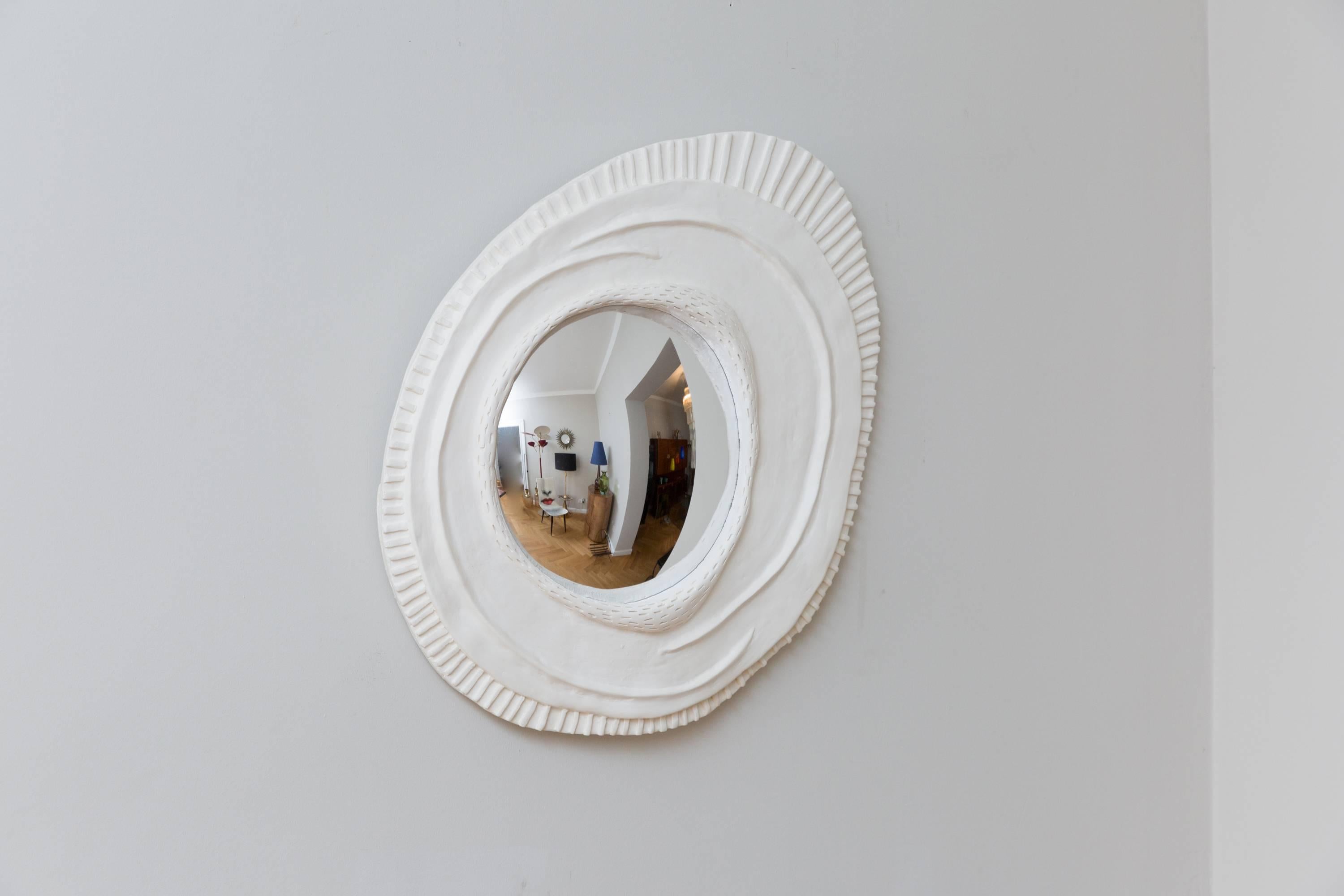 Elegant concave mirror object by Vincent Vauban, France, 2017, limited edition of 10 plaster, convex mirror glass, signed on the backside VINCENT 01/10.
Measures: Length 66 cm, width 53 cm, height 4 cm, diameter mirror 30 cm.