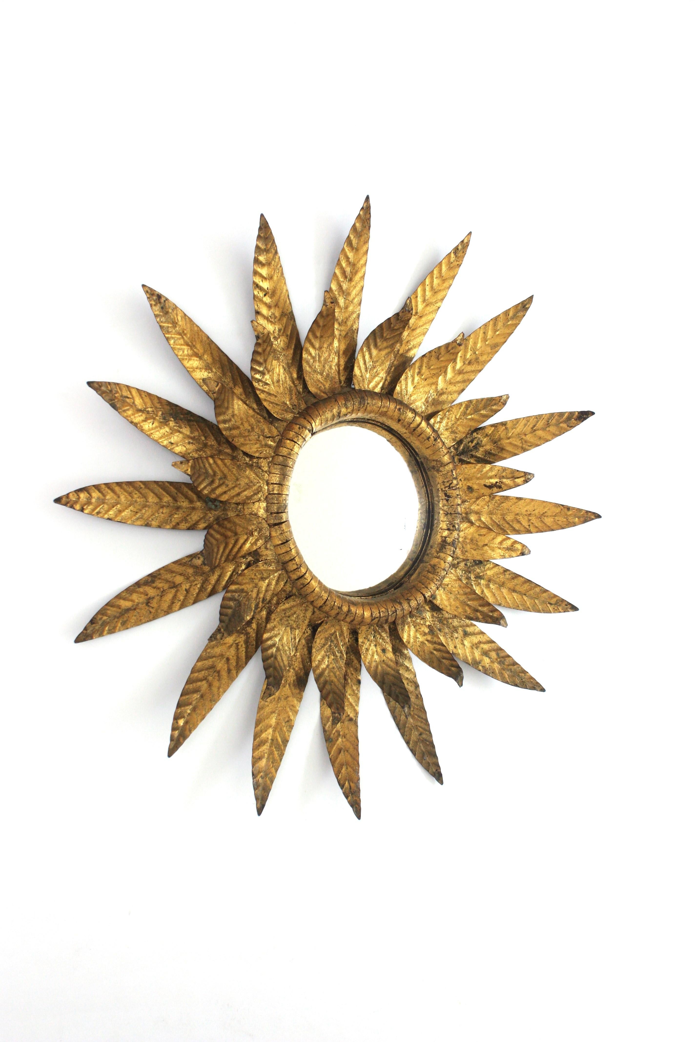 Spanish Convex Sunburst Mirror in Gilt Metal, Double Layered Leafed Frame, Spain 1950s For Sale