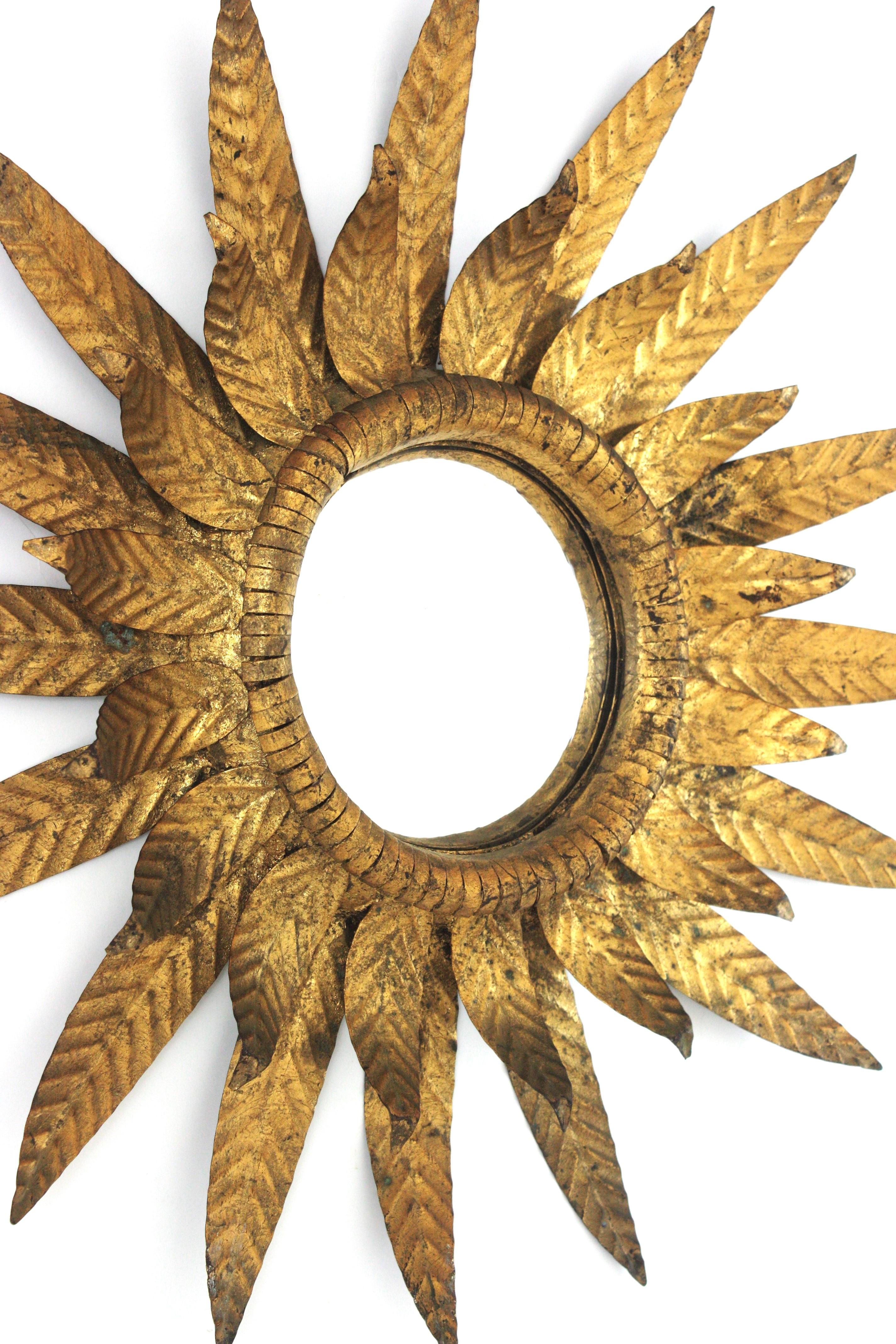 Convex Sunburst Mirror in Gilt Metal, Double Layered Leafed Frame, Spain 1950s In Good Condition For Sale In Barcelona, ES