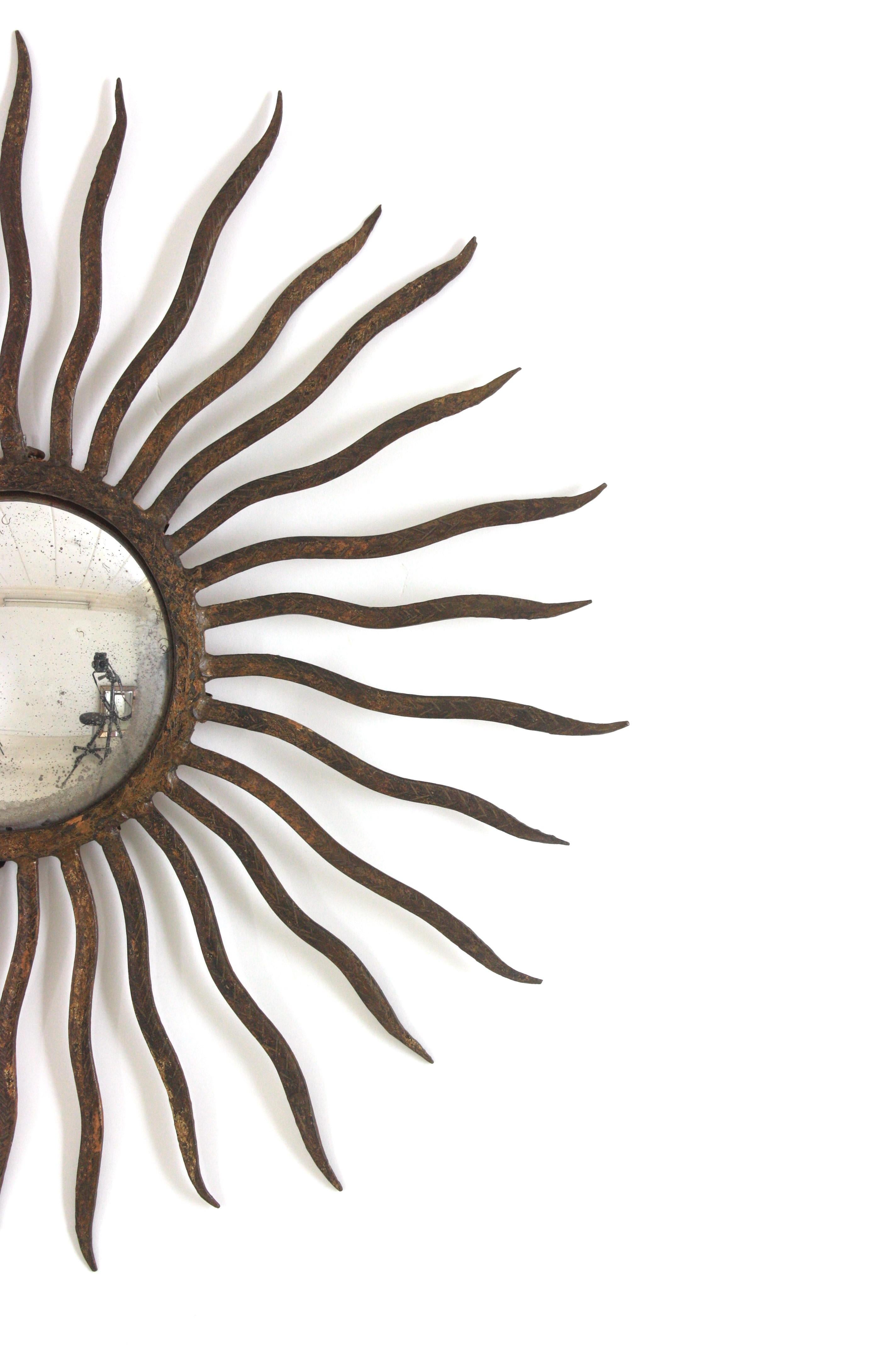 20th Century Convex Sunburst Mirror in the Style of Gilbert Poillerat, Parcel Gilt Iron, 40s For Sale