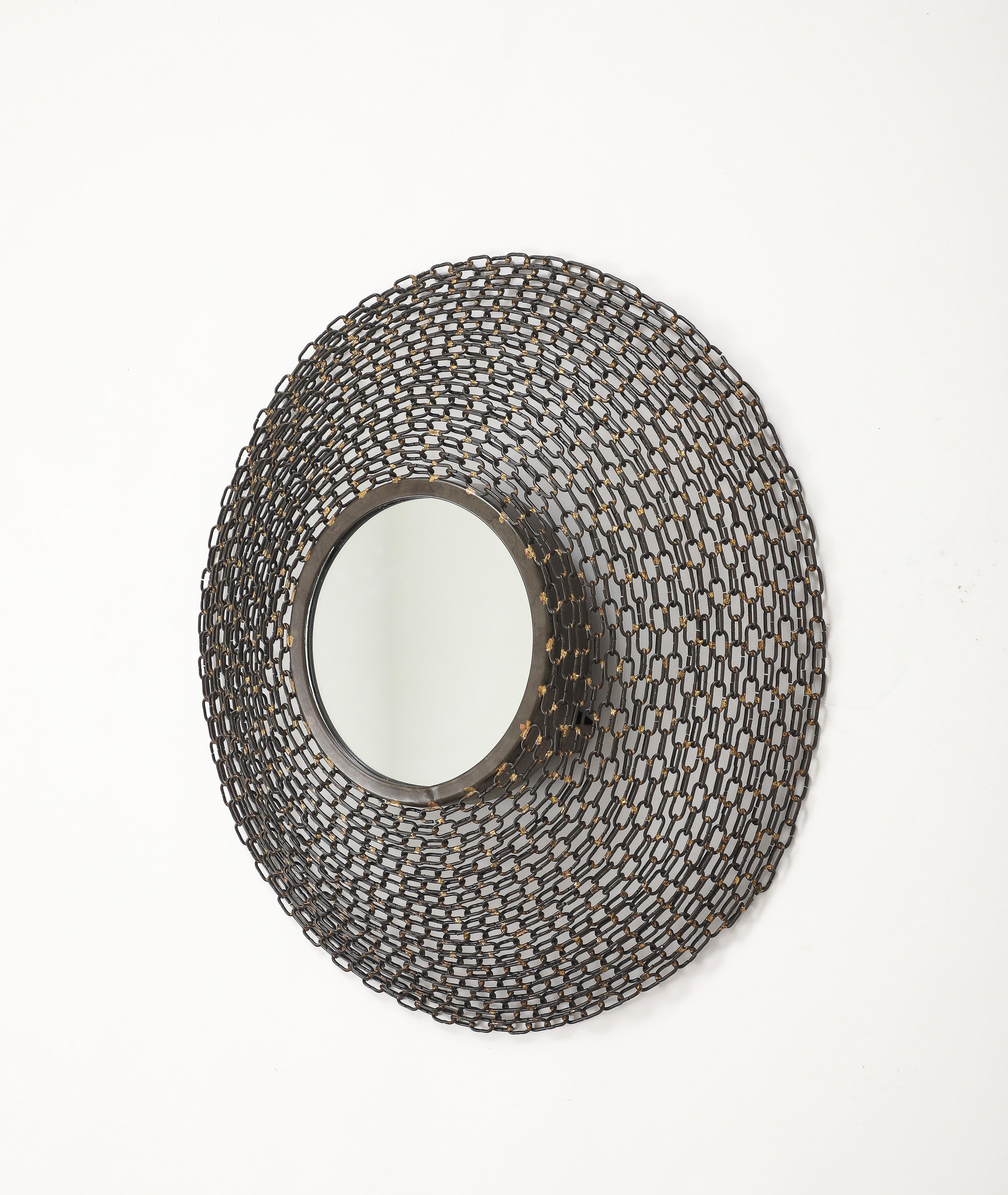 Modernist wall mirror featuring a convex welded chain frame. France, c70s