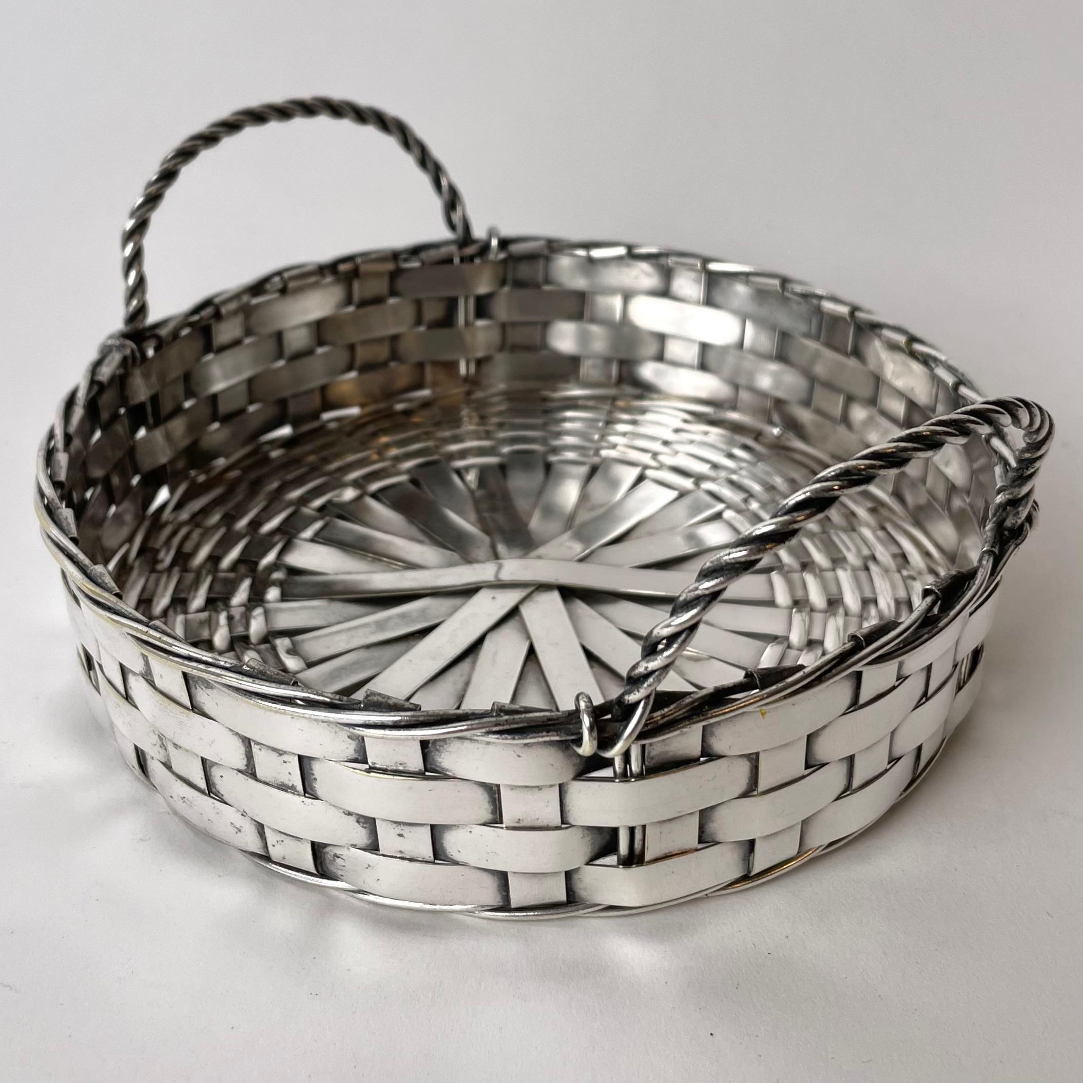 Cool Coaster in braided silver plated metal . Probably made in Europe in the early 20th century. 

Wear consistent with age and use.