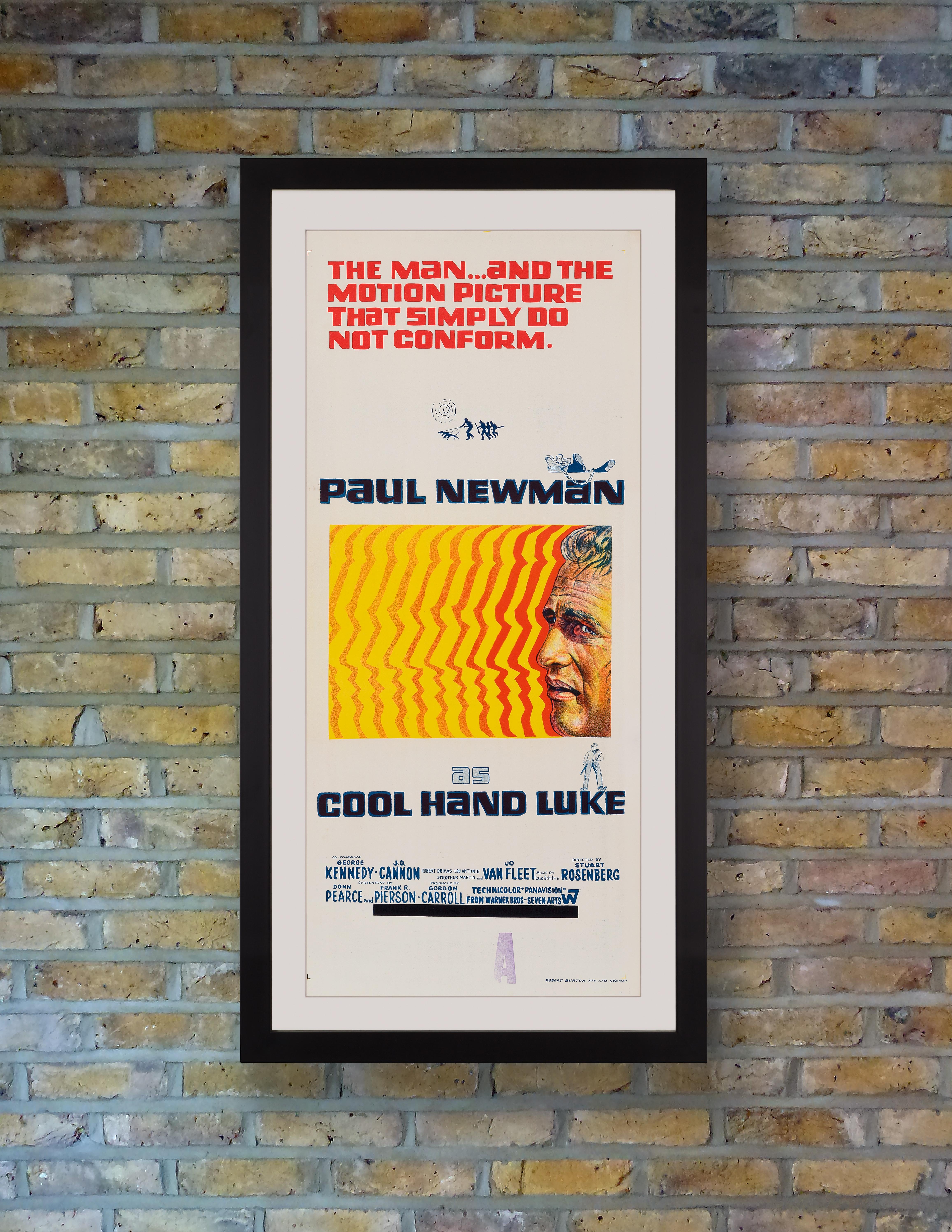An uber cool Australian Daybill for the 1967 American prison drama 'Cool Hand Luke' starring Paul Newman in an Oscar nominated performance as the titular anti-hero, a free spirited prisoner who refuses to conform to the system, as indicated by the