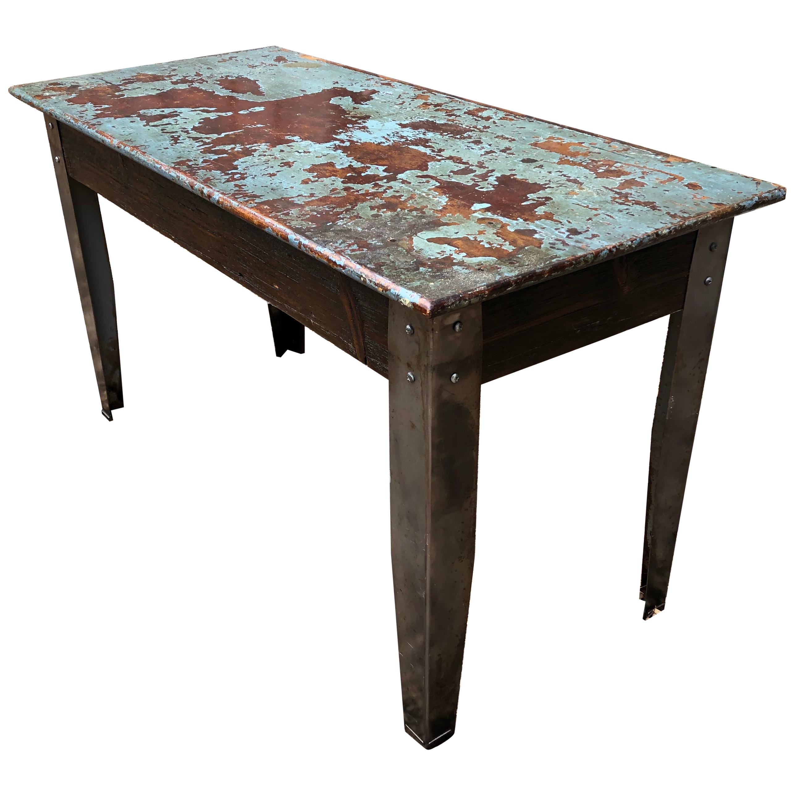 Cool Industrial Distressed Wood Table with Metal Legs For Sale