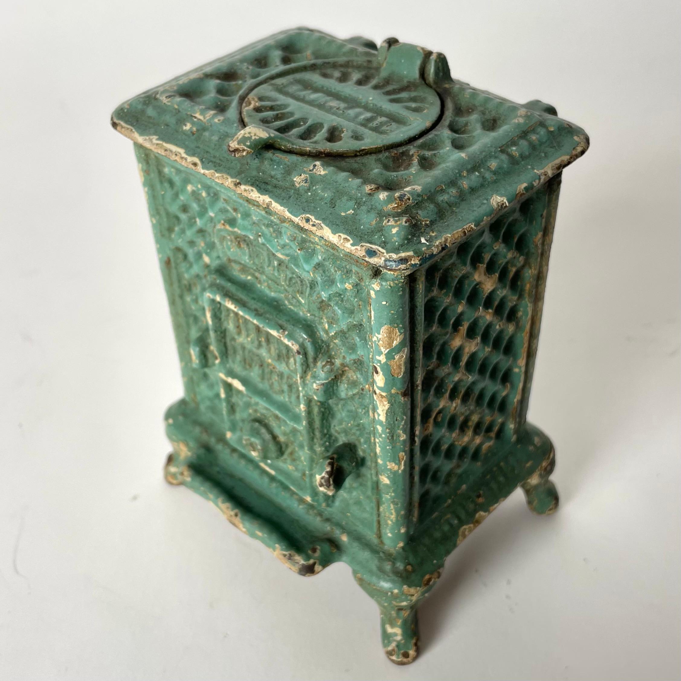 Painted Cool Ink Well designed as a Godin iron stove from the late 19th Century For Sale