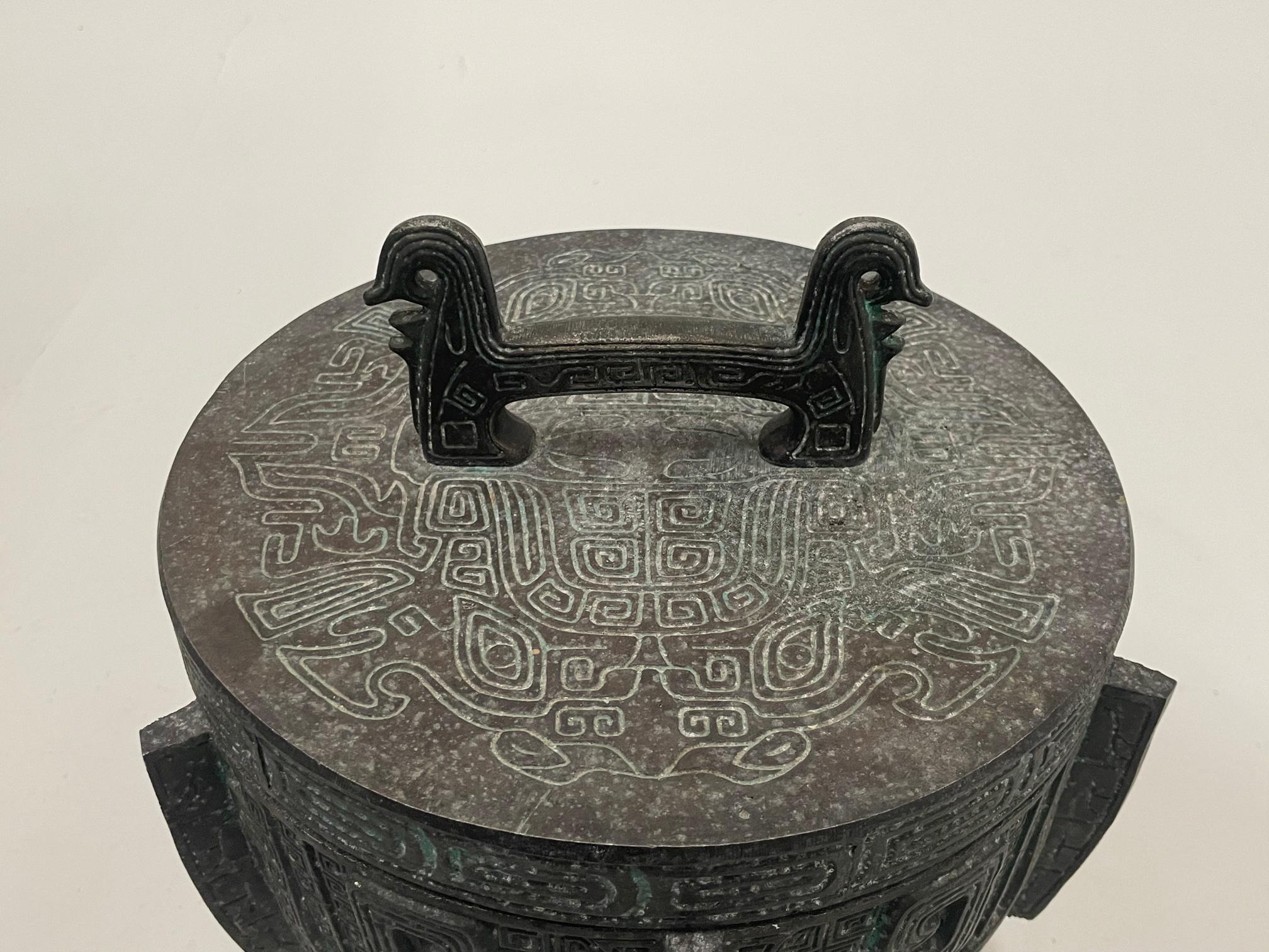 Tan France Auction Pick

Chic James Mont style cast metal ice bucket with Asian flair and a verdigris finish. There's a chrome and bright green liner.