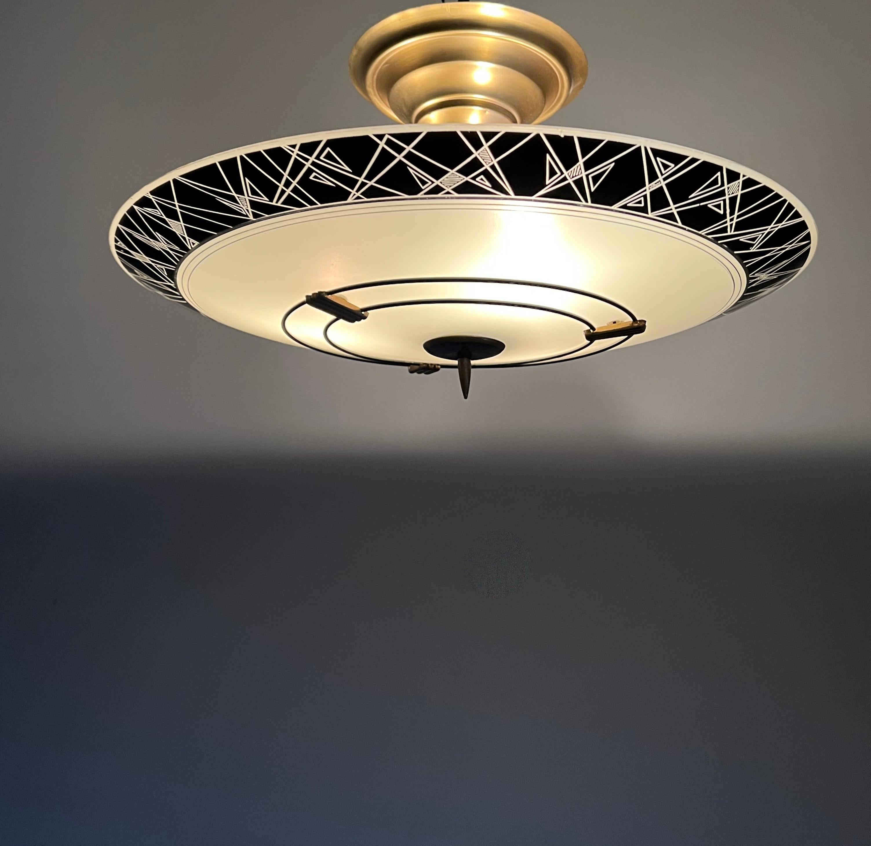 Great looking, three light midcentury flush mount with 23