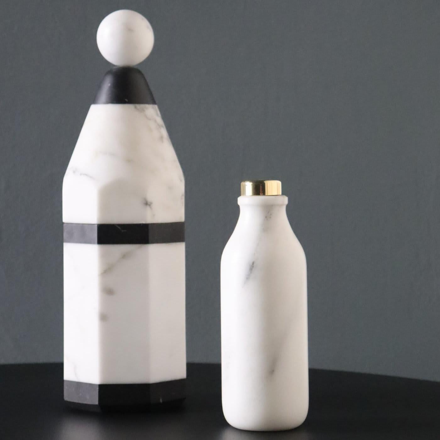 This striking bottle is part of the Coolers collection, featuring a mix of minimalist designs and precious materials, traditional crafting methods, and a contemporary sensibility, resulting in bottles that are stunning to behold and useful, since