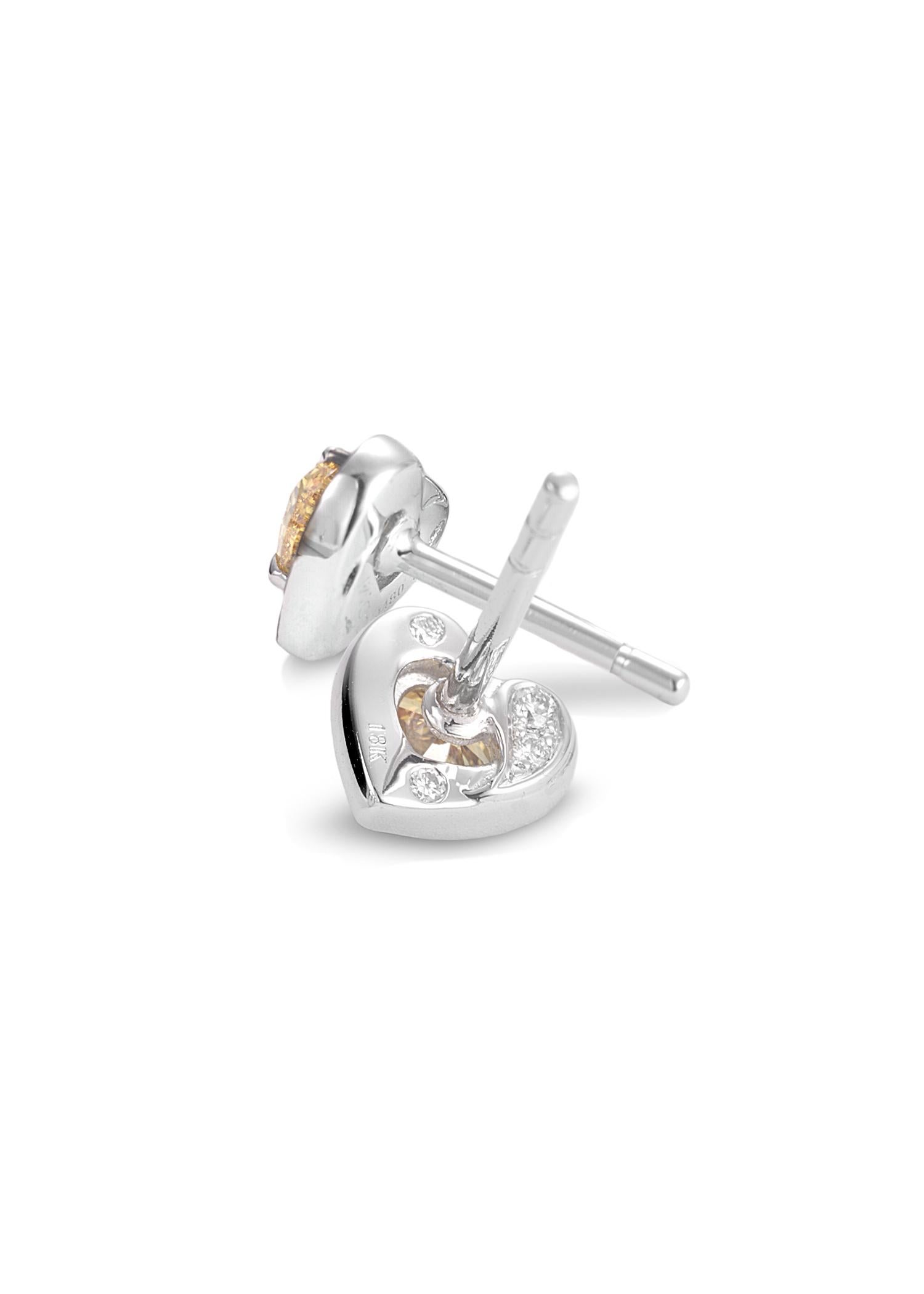Trinity collection heart-shaped stud earrings set in 18K White Gold with Vivid Orange 0.46ct and Black Diamonds. 