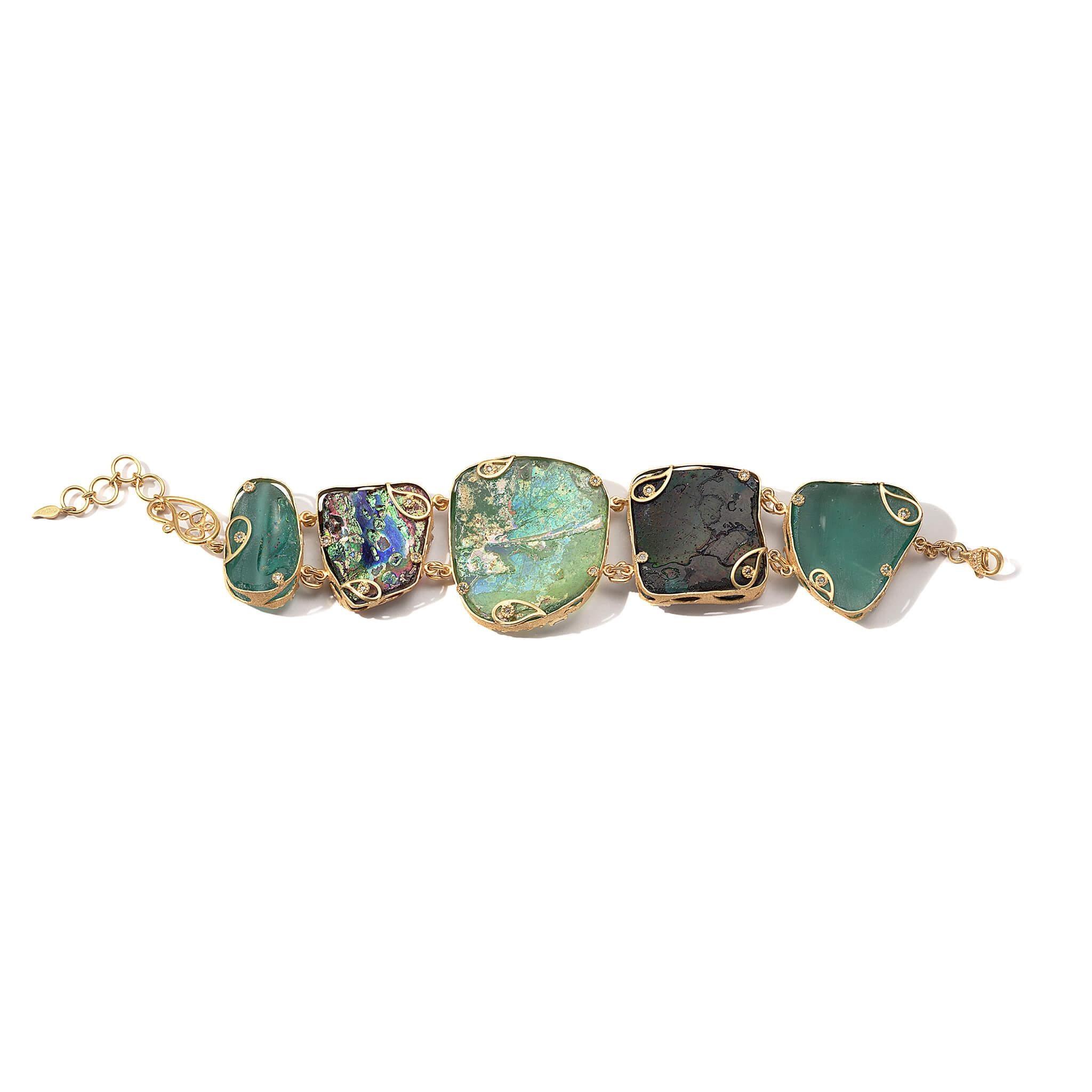Coomi ancient Roman glass bracelet set in 20K yellow gold with 2.06cts diamonds.

Coomi presents her latest addition to the Antiquity collection, Ancient Roman Glass. Each slice of the world’s first handblown glass, dating back to the 1st century