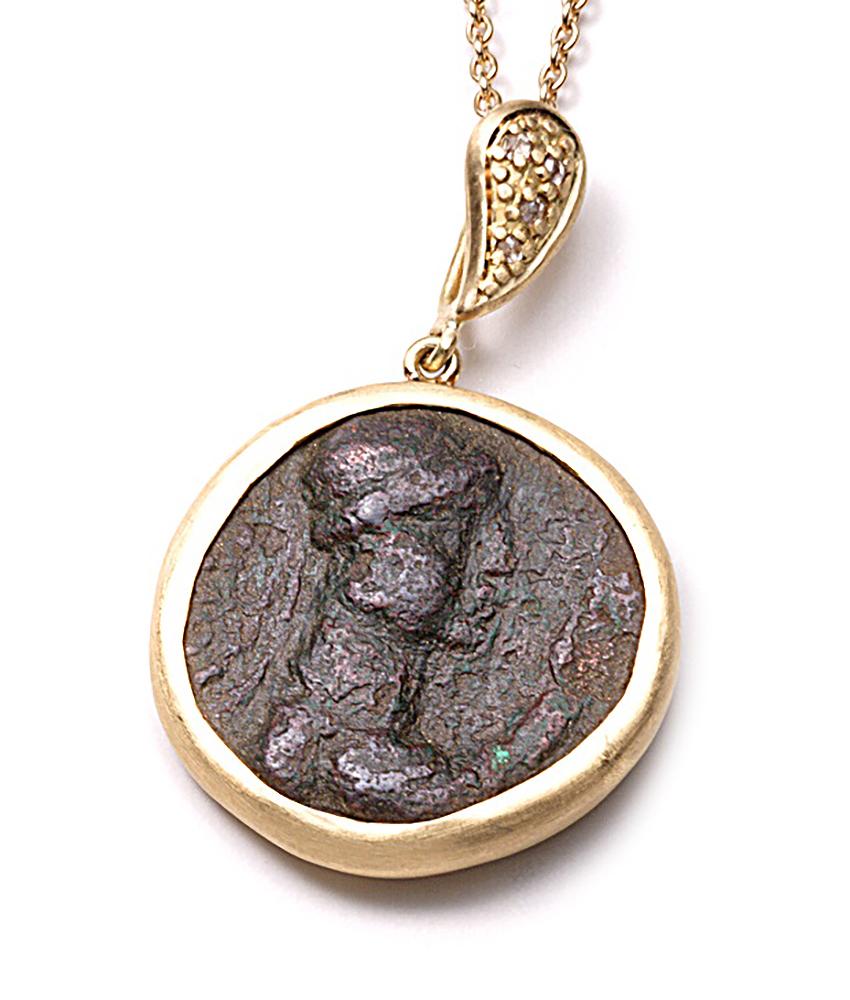Hand made Coomi antique pendant set in 20K yellow gold with indo-Greek center coin and 0.05cts rose cut diamond accents on paisley-shaped bale. Comes complete with 24 inch 20K yellow gold chain with 0.36cts scattered diamond stations.

Necklace