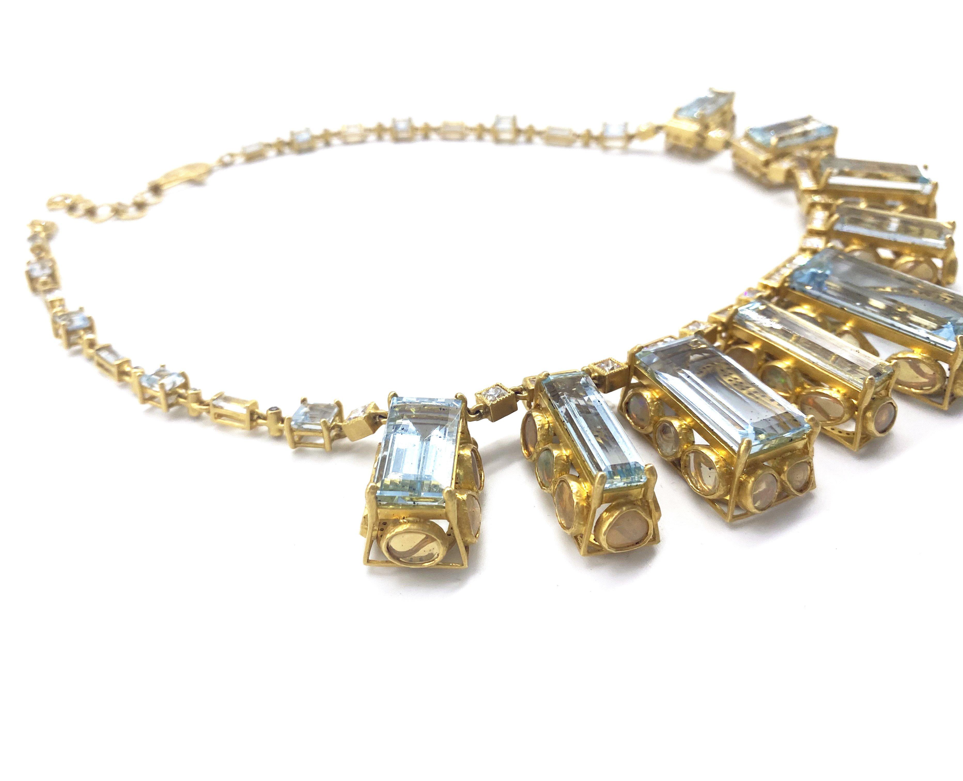 Affinity Necklace set in 20K Yellow Gold. 126.85cts Aquamarine, and 15.49cts Opals, 10.17cts Diamonds. Necklace measures at 16inches with a 2inch extender. 

15.49cts Opals
126.85cts Aquamarine 
10.17cts Diamonds 
16 Inches with 2-inch extender
20K
