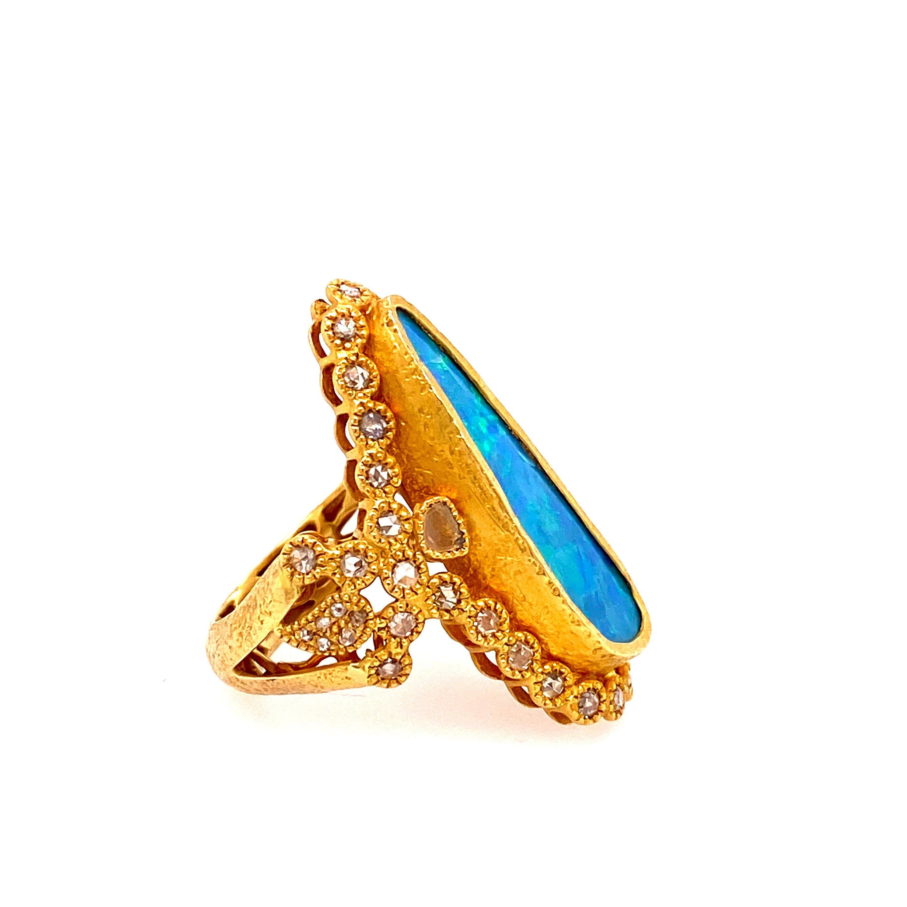 Affinity ring set in 20K Yellow Gold. 8.25ct Australian Opal, and Rose-Cut Diamonds 1.16ct. The size of the ring is 0.25 inches in height.