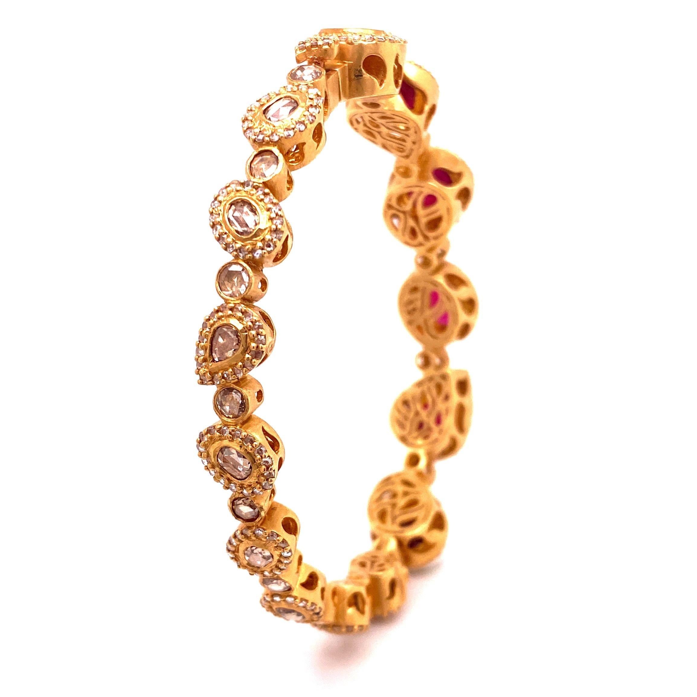 Affinity Bracelet set in 20K Yellow Gold. Ruby 9.77cts, and Rose-cut Diamond on the back of bracelet 3.39cts. 

20K Yellow Gold 
9.77cts Ruby 
3.39cts Diamonds 