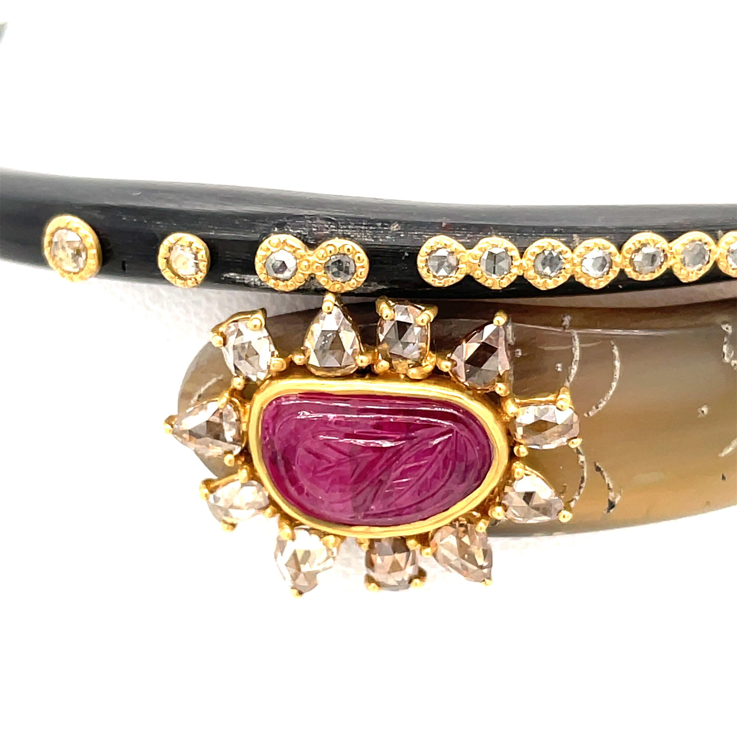 Coomi Horn Bangle with 20K Yellow Gold Accents Rubies and Diamonds.  Fits a 7 inch wrist or smaller.  Slips on to wrist.  
29 Diamonds and One Carved Ruby
Stamped Coomi 20K 