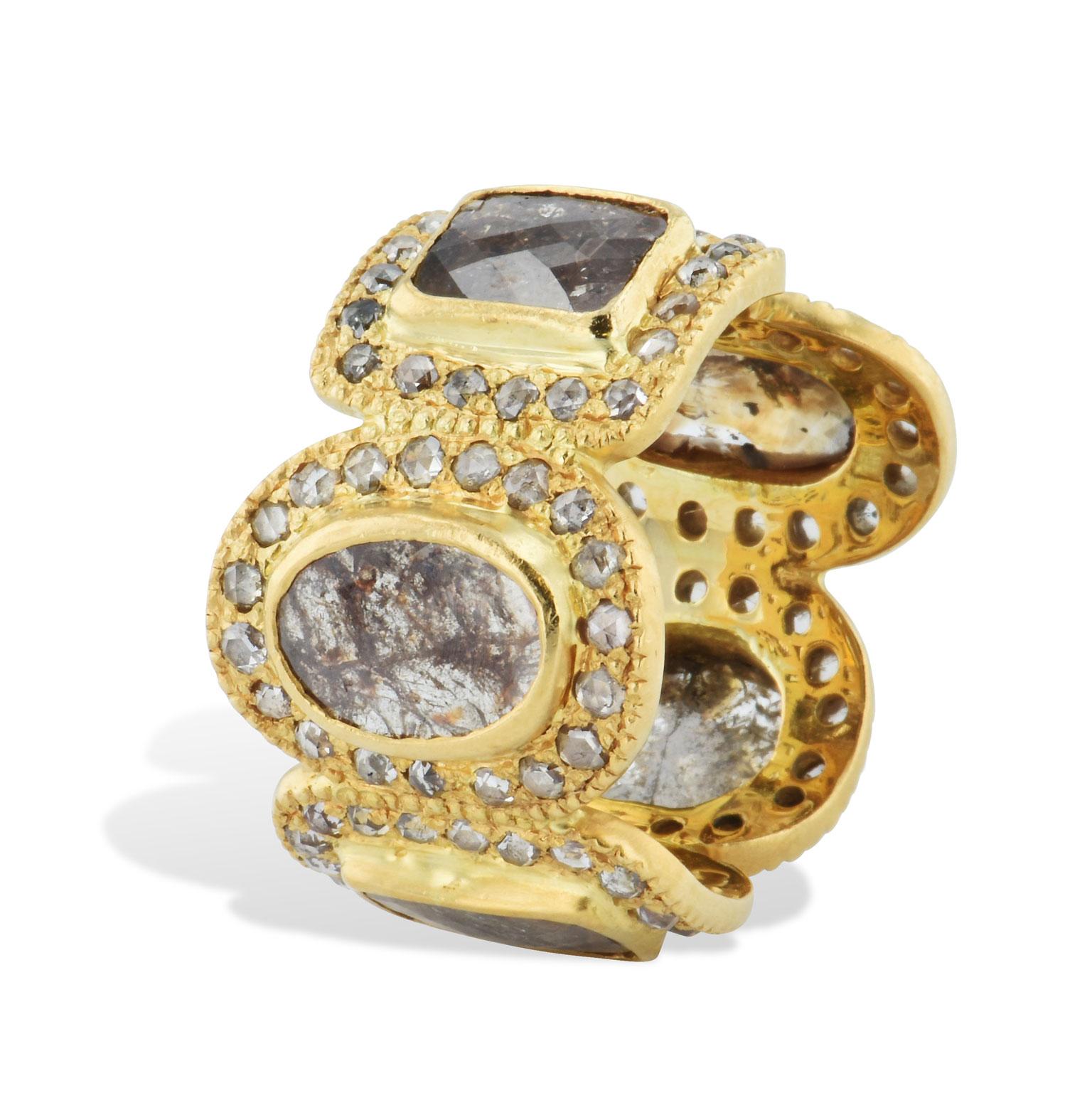 This previously loved Coomi luminosity diamond slice ring features 98 rose cut diamonds and five diamond slices, fashioned in 18 karat yellow gold. This piece is bold, vibrant, and shines from within while allowing the wearer to get comfortable with