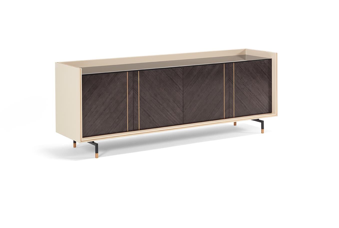 The straight-lines COOPER sideboard was designed for modern and sophisticated interior design spaces. The embracing wooden structure and the doors can combine different finishes for a unique result. The metallic feet gives it lightness and a modern