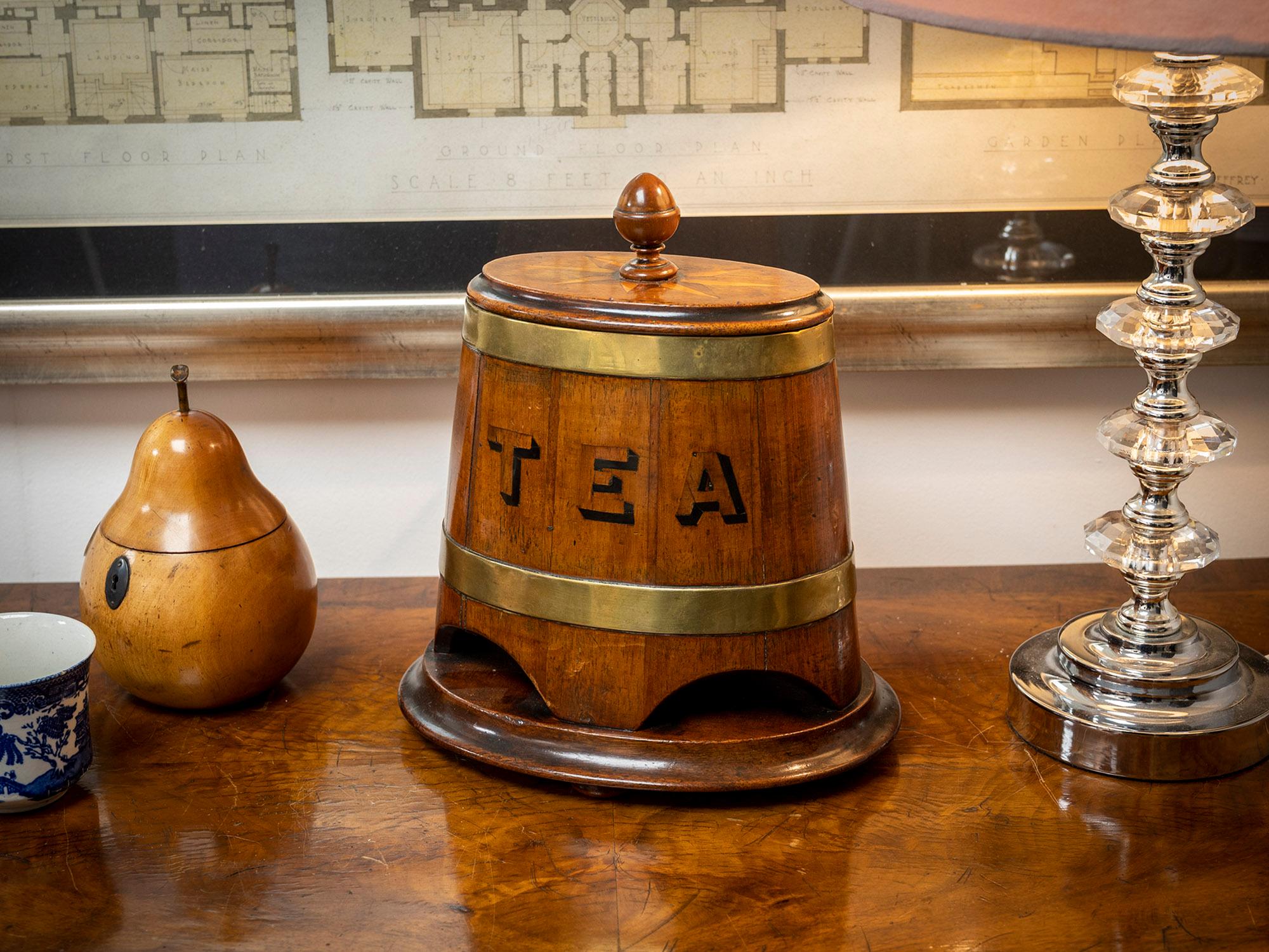 Rare & Unusual Advertising Tea Barrel Caddy
The Tea Caddy modelled in the form of a coopered barrel complete with two thick brass straps around a beautifully patinated body with a mahogany plinth having a cavetto edge. The lid with a matching