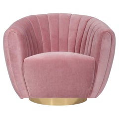 Swivel Copa armchair upholstered in pink velvet by Bow and Arrow