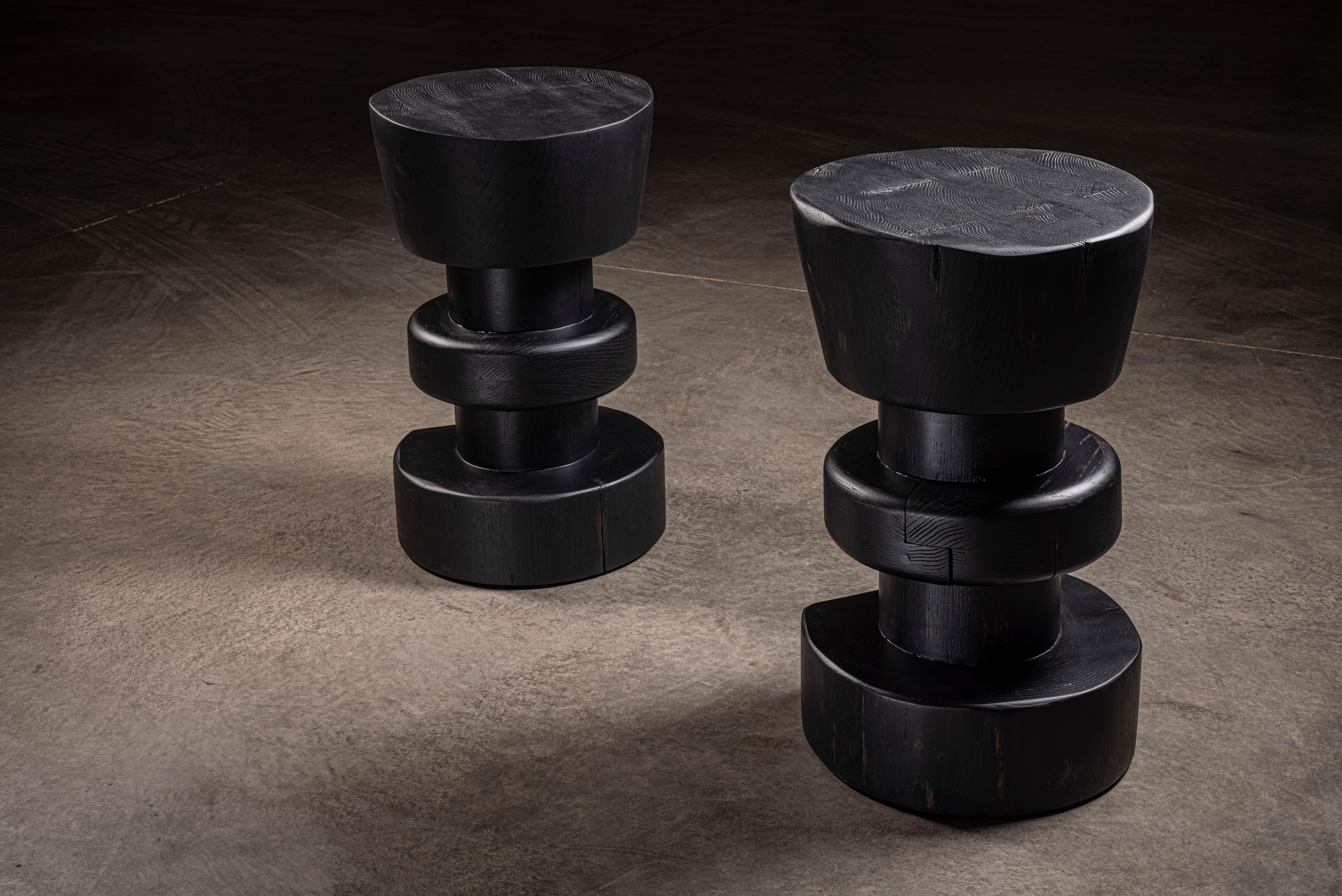 Inspired in a chess piece, this heavy and solid oak stool is 100% handcrafted with a matte black finish.