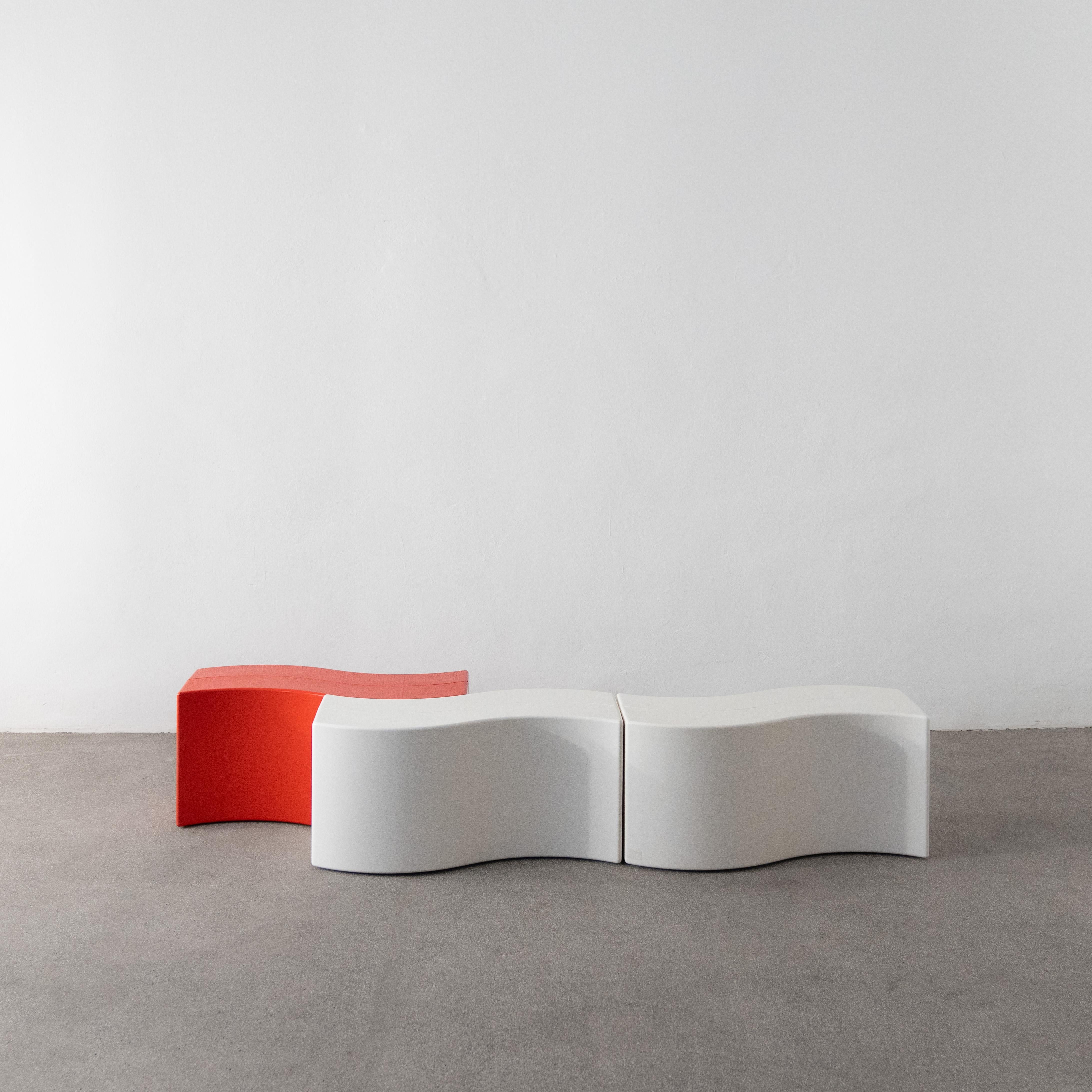 Three Copacabana side tables by Eero Aarnio for Adelta. The tables are unused and have been in storage for the last few decades. The set consists of two white & one red element. They can be used as a coffee table or as a bench. Suitable for indoor