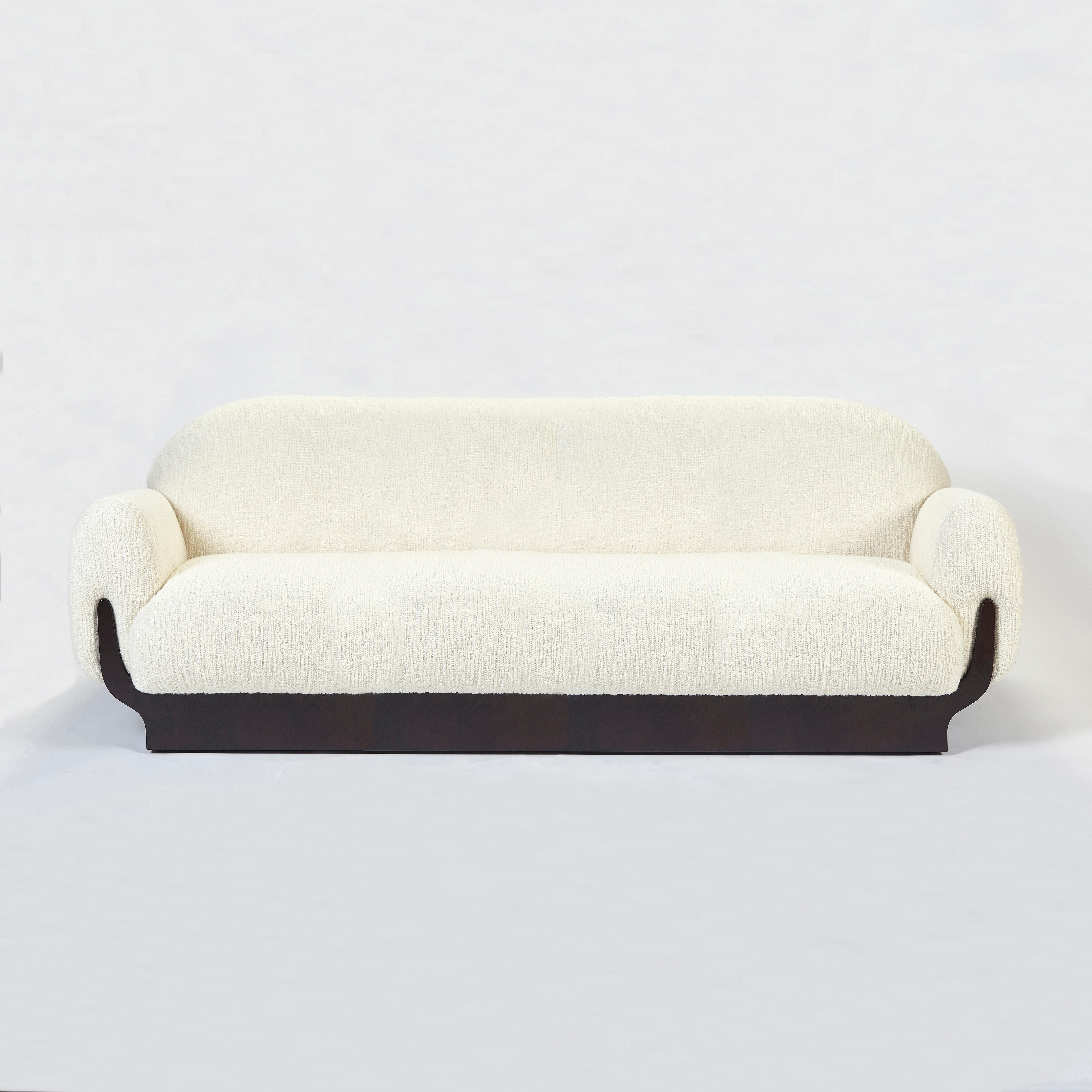 Copacabana Sofa by Duistt
Dimensions: W 250 x D 98 x H 84 cm
Materials: Zinc - Clayton Ivory Fabric, Darkened Oak

With a bohemian look, the Copacabana sofa is the perfect blend of unique style and cosy comfort. Inspired by the sidewalks of Rio de