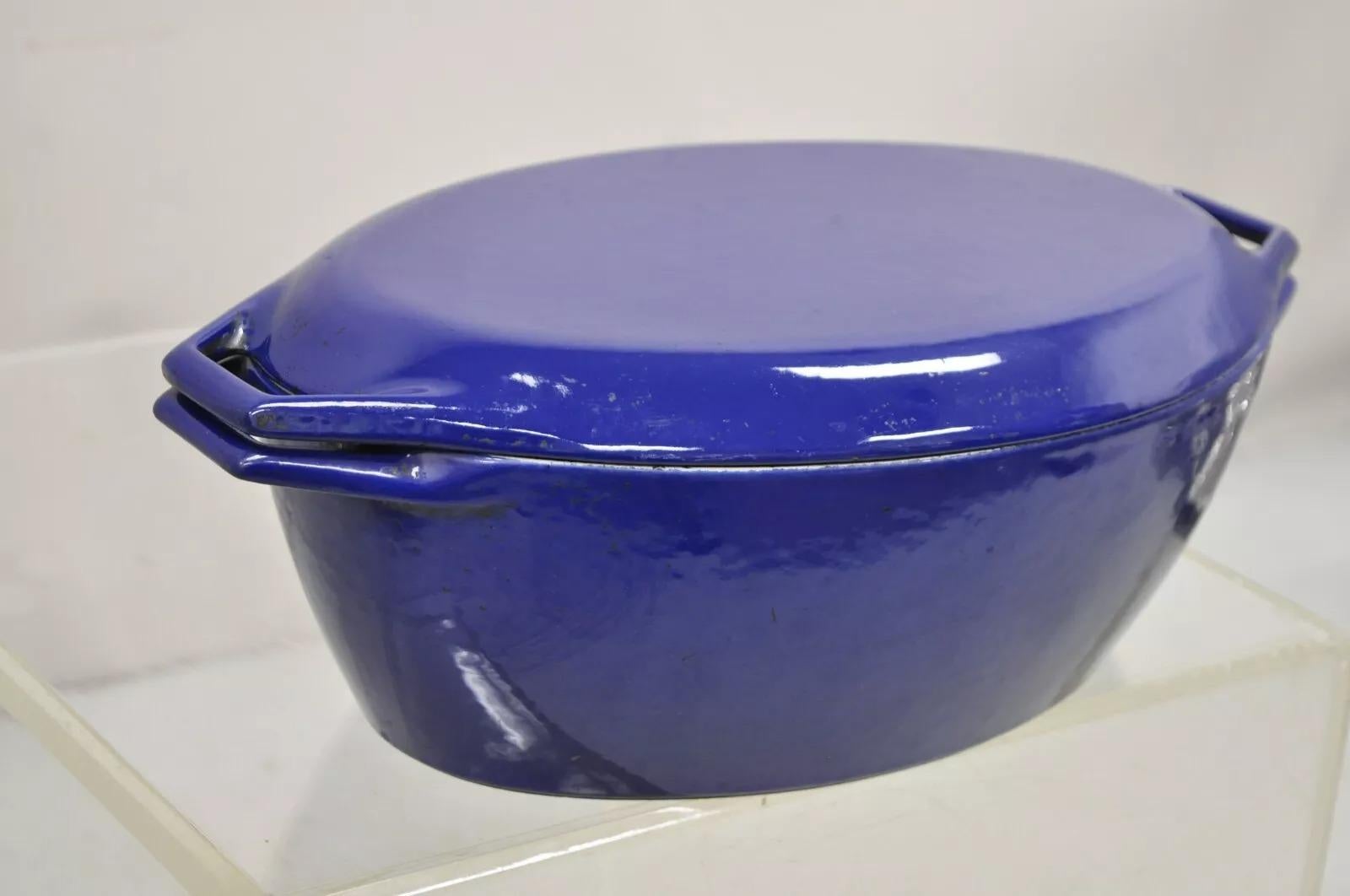 Vintage Copco Denmark Dutch Oven Deep Blue Enameled Cast Iron Oval Lidded O2 Model Pot. Circa Mid 20th Century. Measurements: 5.5