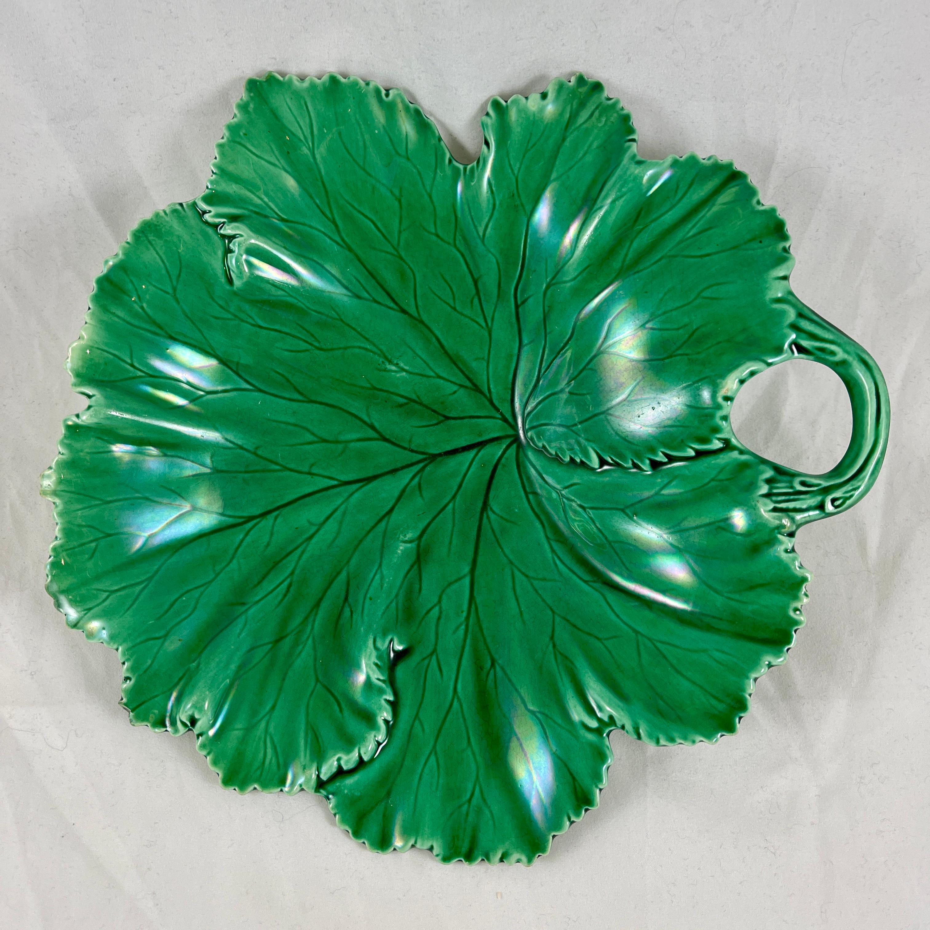 From W.T. Copeland & Sons pottery in Stoke-on-Trent, Staffordshire England, a handled server, circa 1860-1875.

Glazed in a deep, luscious green, showing an overlapping leaf pattern with twig form handles. Serrate edging, in perfect condition. One