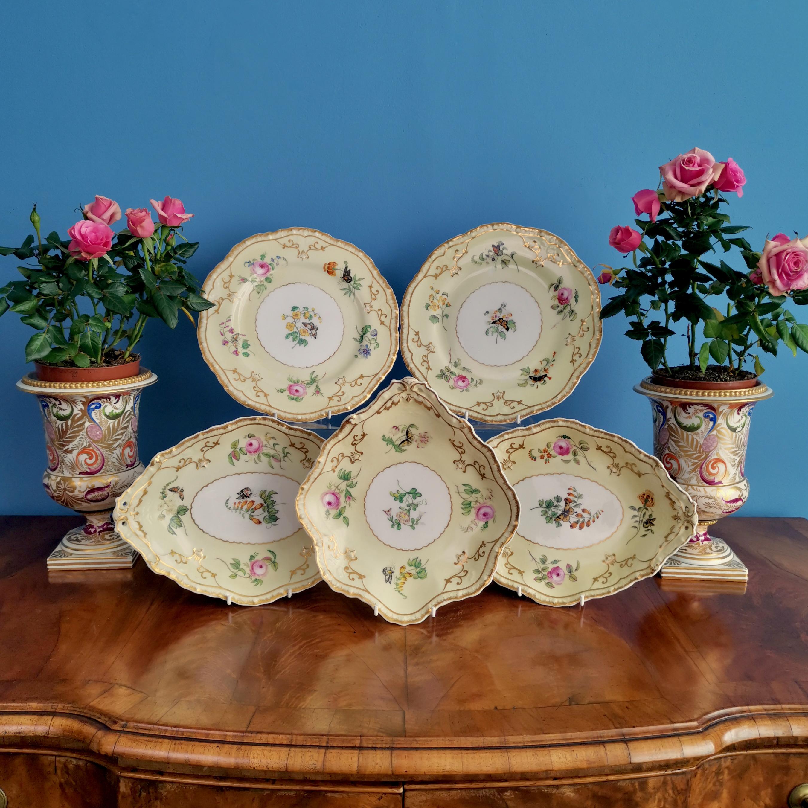 This is a very charming set of dessert plates made by Copeland & Garrett between 1833 and 1847, which was the Rococo Revival era. The service is made of Felspar porcelain and decorated in yellow with flowers and butterflies. The service consists of