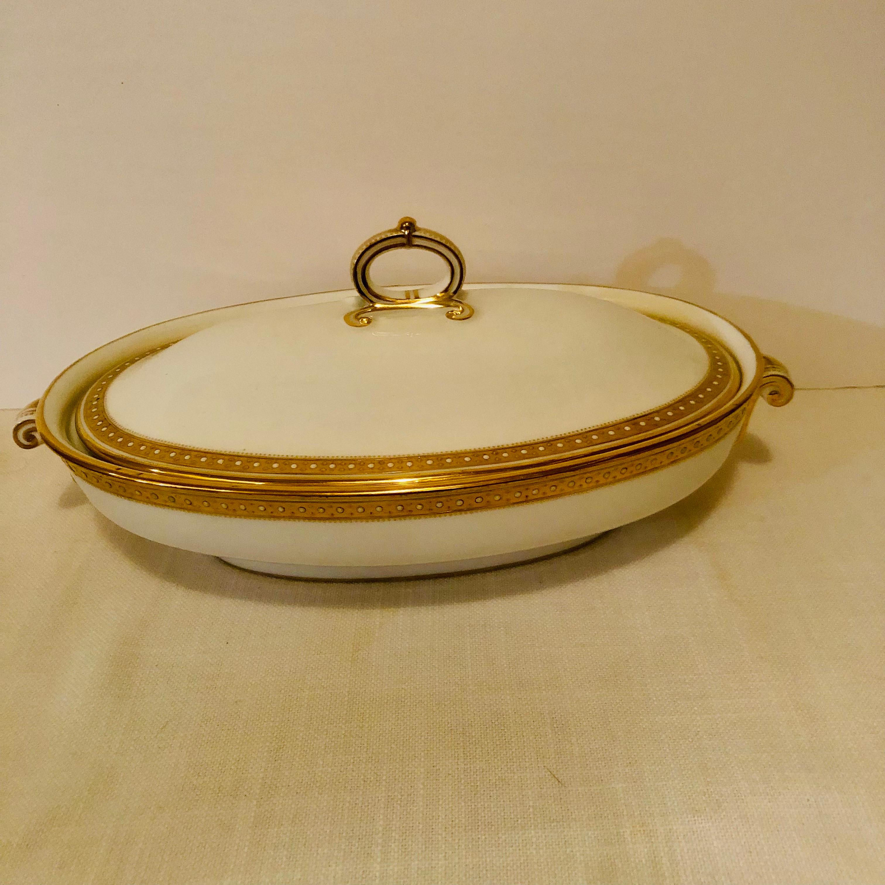 This is a lovely Copeland Spode covered vegetable with a gold border and white enamel jeweling on a white porcelain ground. This covered vegetable definitely looks like simple elegance, and it would look beautiful with any dinnerware you already