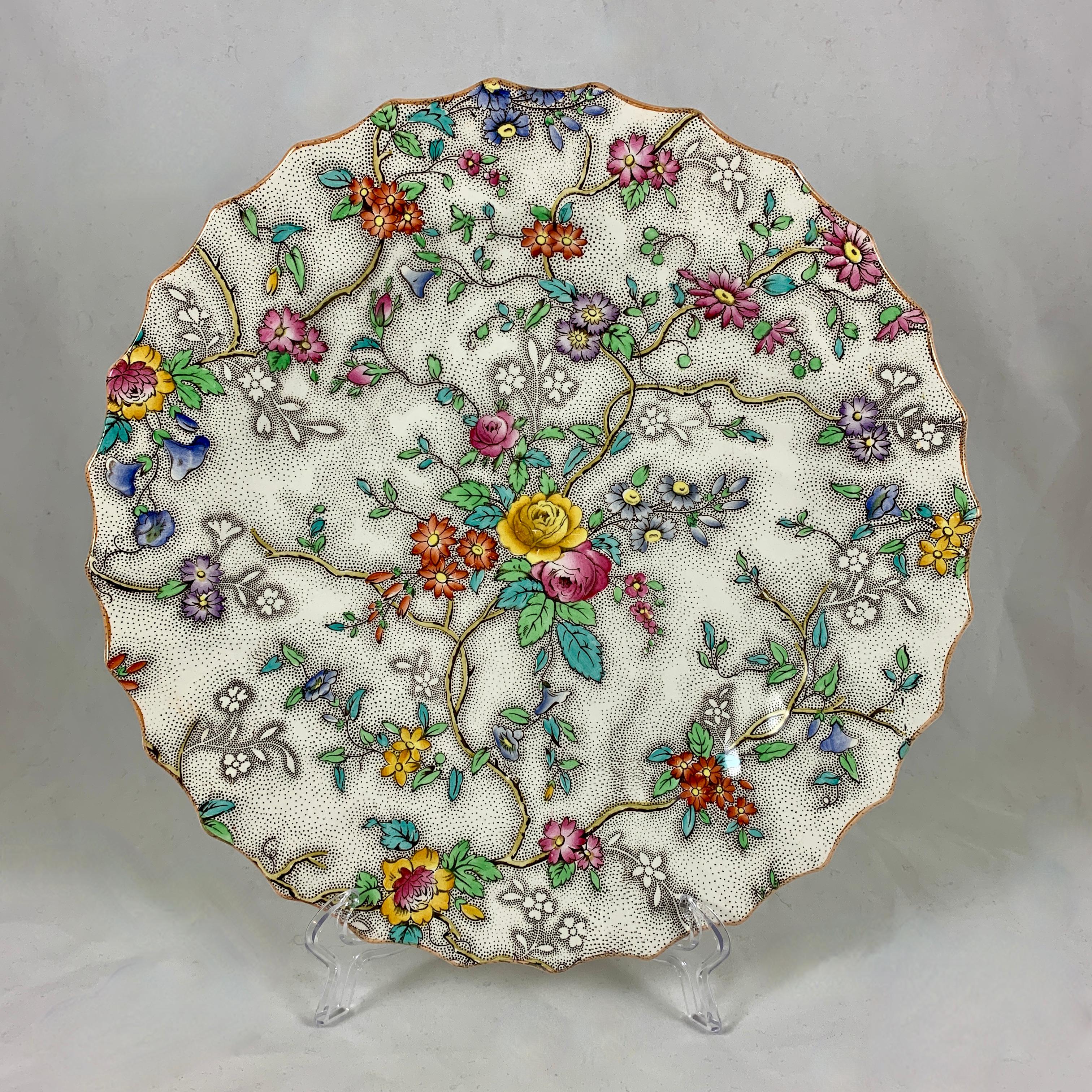 A set of six dinner plates in the floral ‘Patricia’ pattern, Copeland Spode, England, circa 1912-1940. 

Often referred to as the ‘Rose Chintz’ pattern, showing a complex sheet transfer of a multi-colored floral on a black stippled ground. Hand