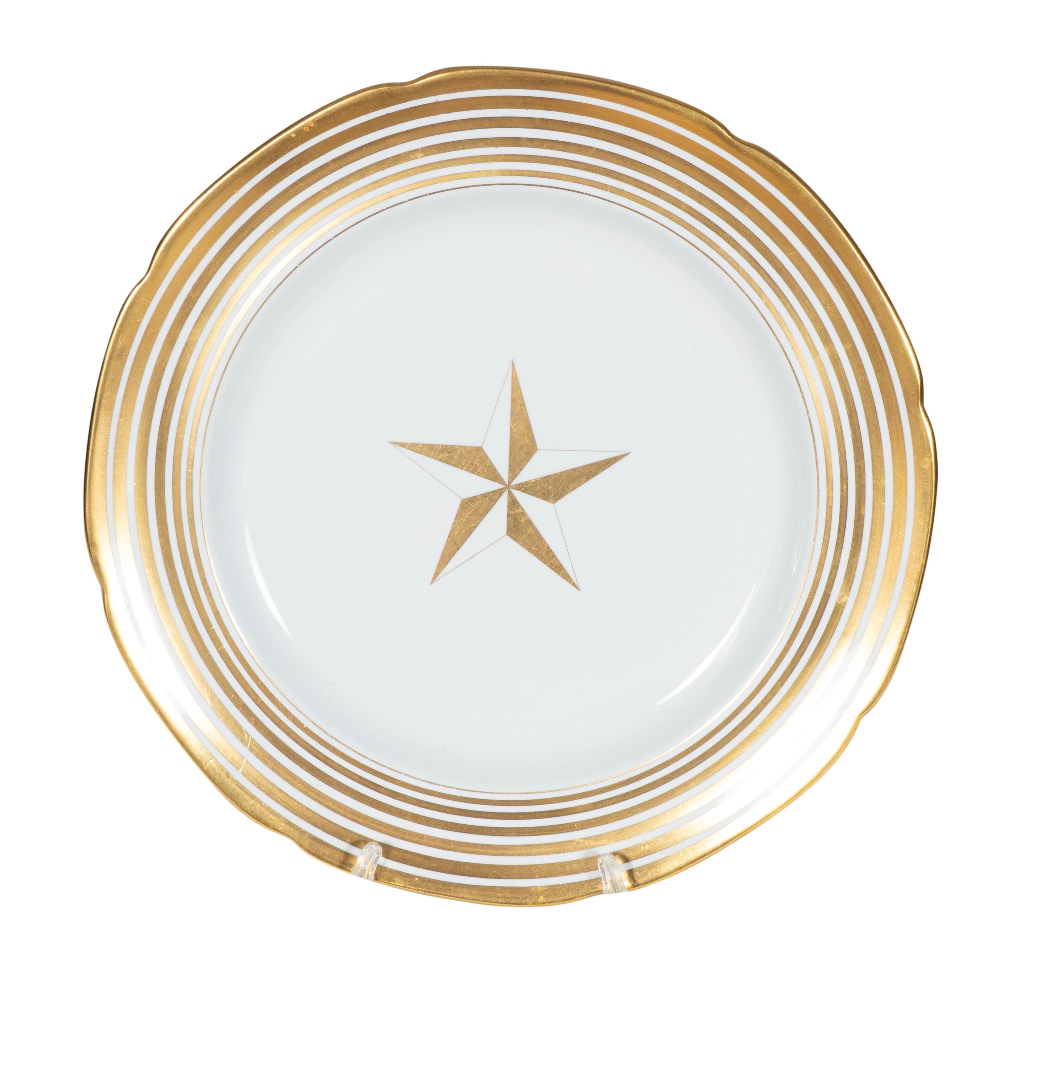 Unusual pattern with gold stars. Marked Copeland Spode , New Stone. England. Comprising 13 dinner plates, 12 salad plates , 12 bread plates,8 cups and saucers.