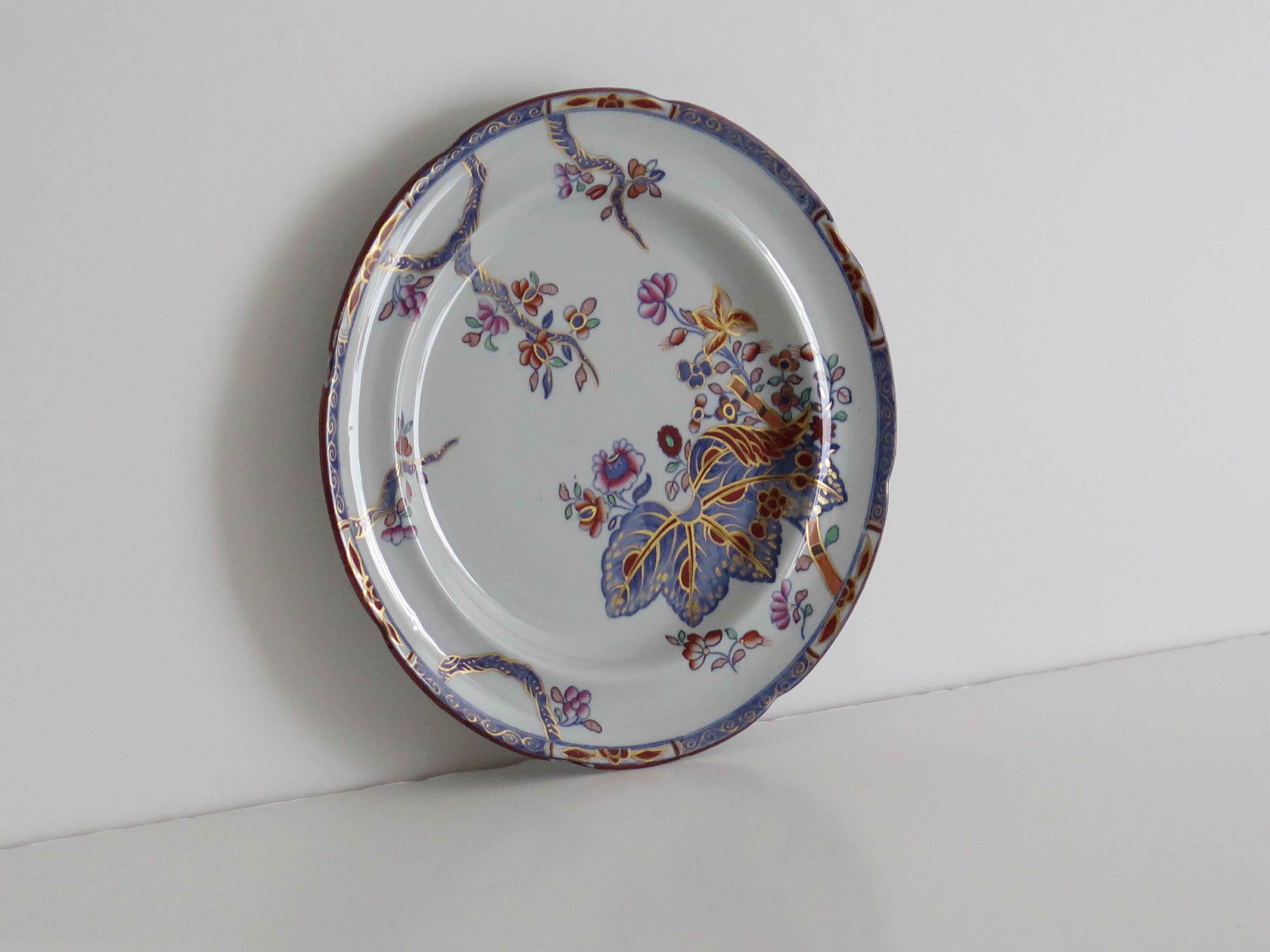 This is a good stone China (Ironstone) large Dinner Plate, hand painted in the tobacco leaf pattern, number 2061, made by the Copeland (Spode) factory in the 19th century, English Victorian period, circa 1880.

The Plate is made from Ironstone China