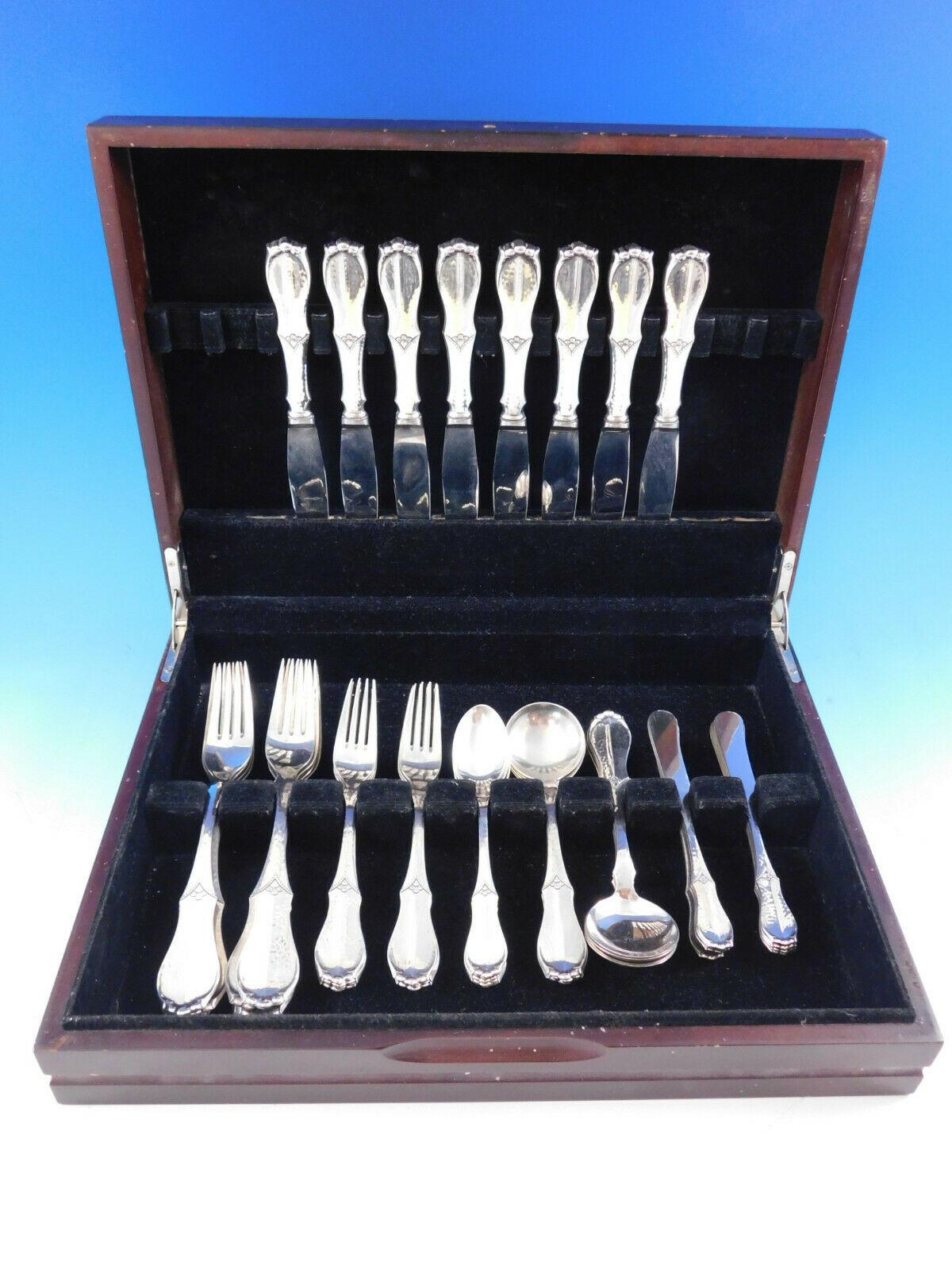 Hand wrought Danish sterling silver flatware set by Copenhagen Silver Industry Ltd. - 46 pieces. This set includes:

Bonus8 dinner forks, 7 7/8