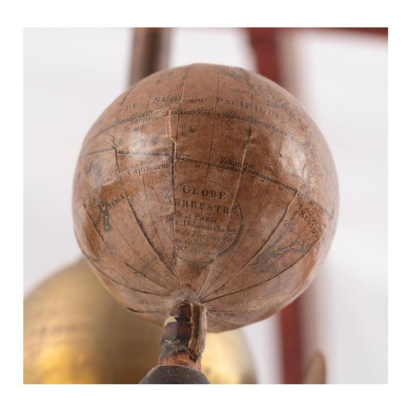 Copernican-type planetary globe in cardboard and engraved paper mounted on a blackened wooden stand. France, circa 1810. H. 54 cm Diam. 36 cm Antique armillary spheres and planetaria from XVIII – XIX, Ptolemaic sphere and Copernicus models. The