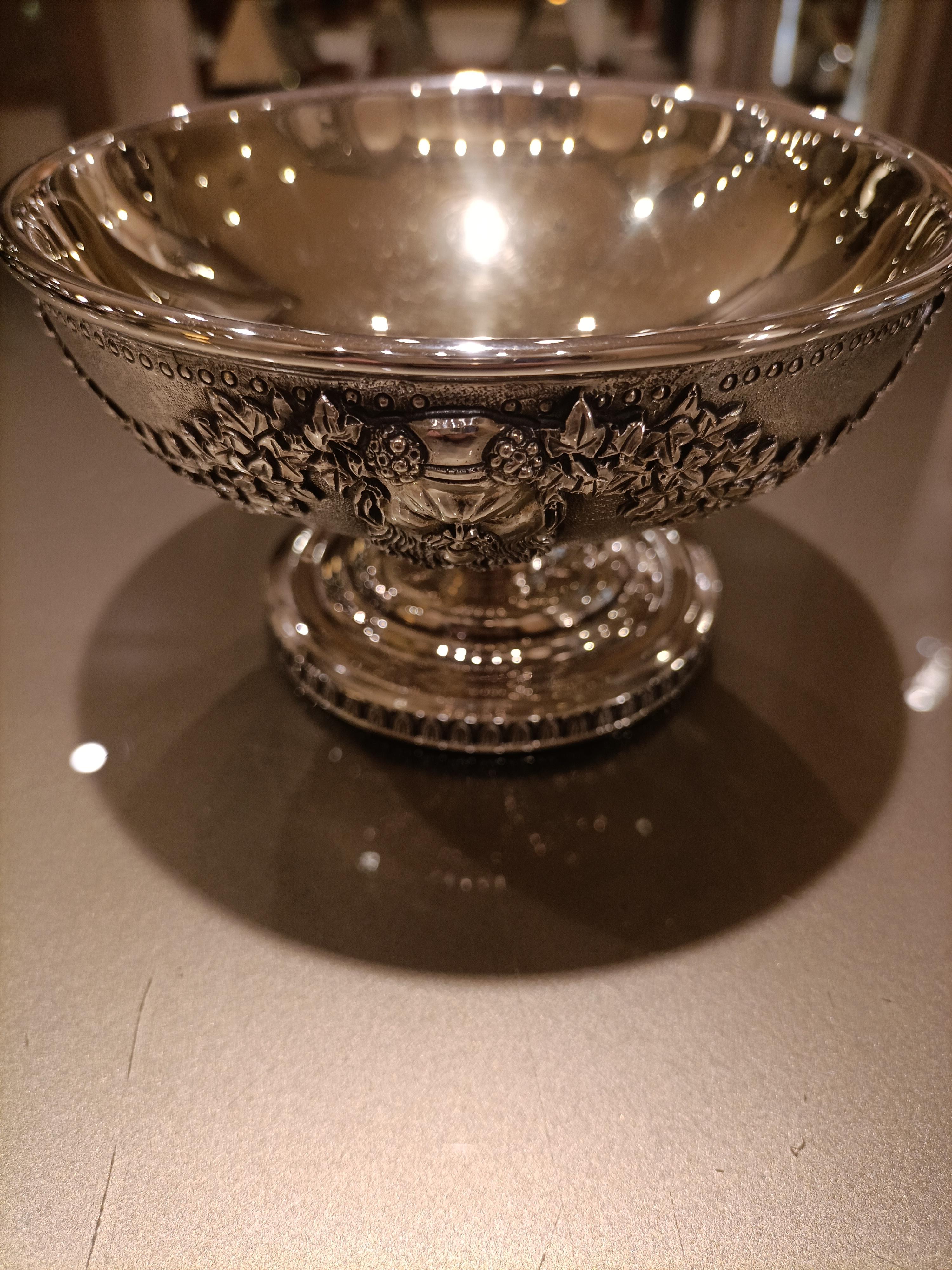 Silver cup with vermeil interior. The exterior is entirely hand-decorated with engravings of fauna and flora motifs. It is made of solid silver by Italian manufacture. The cup, chalice are symbols of good luck for a friendship or professional