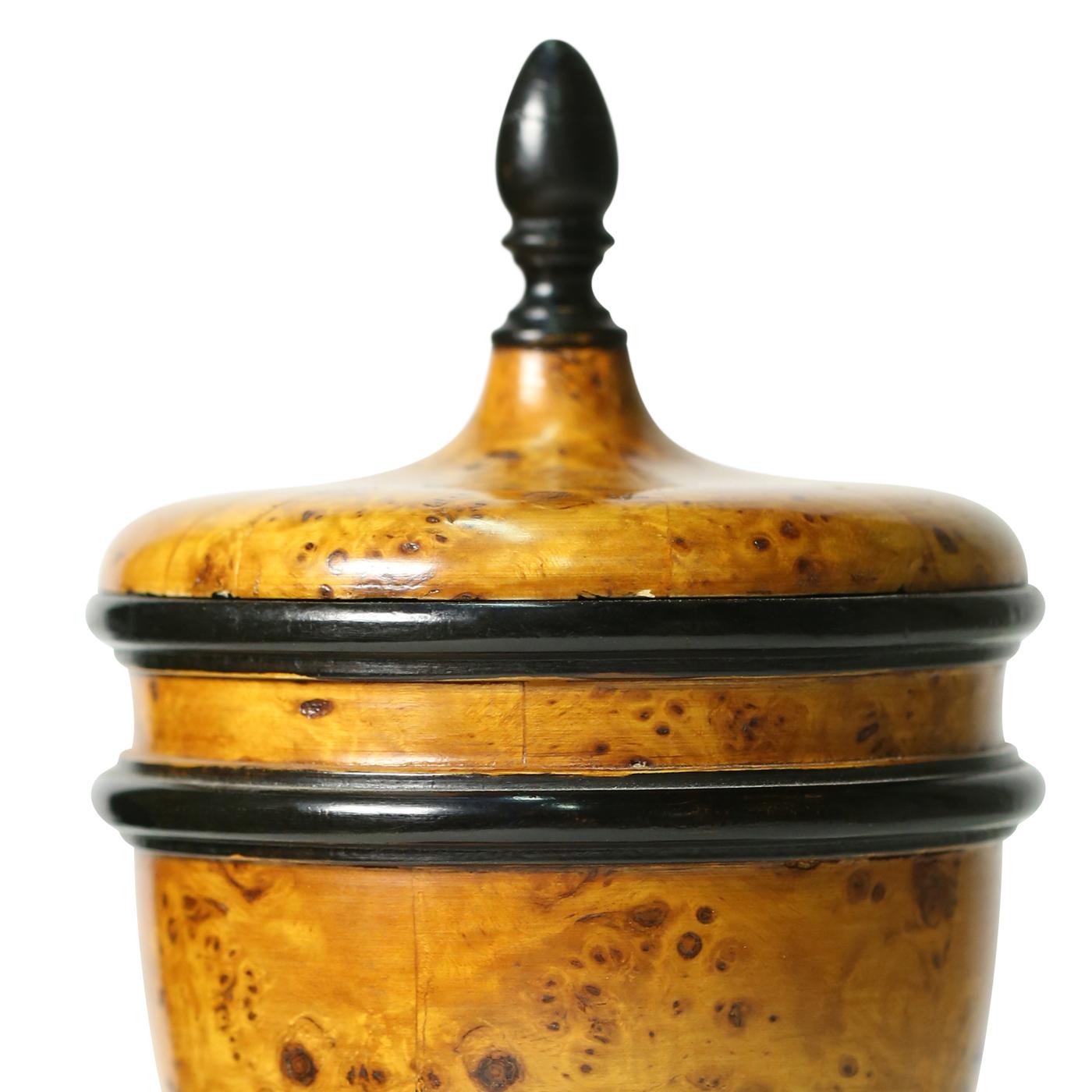 This is an elegant urn by Florentine wood carver Castorina. The piece is entirely handcrafted, creating the wood structure that is then covered with briar wood and polished to a brilliant finish using the traditional technique of Ferrara. The vase