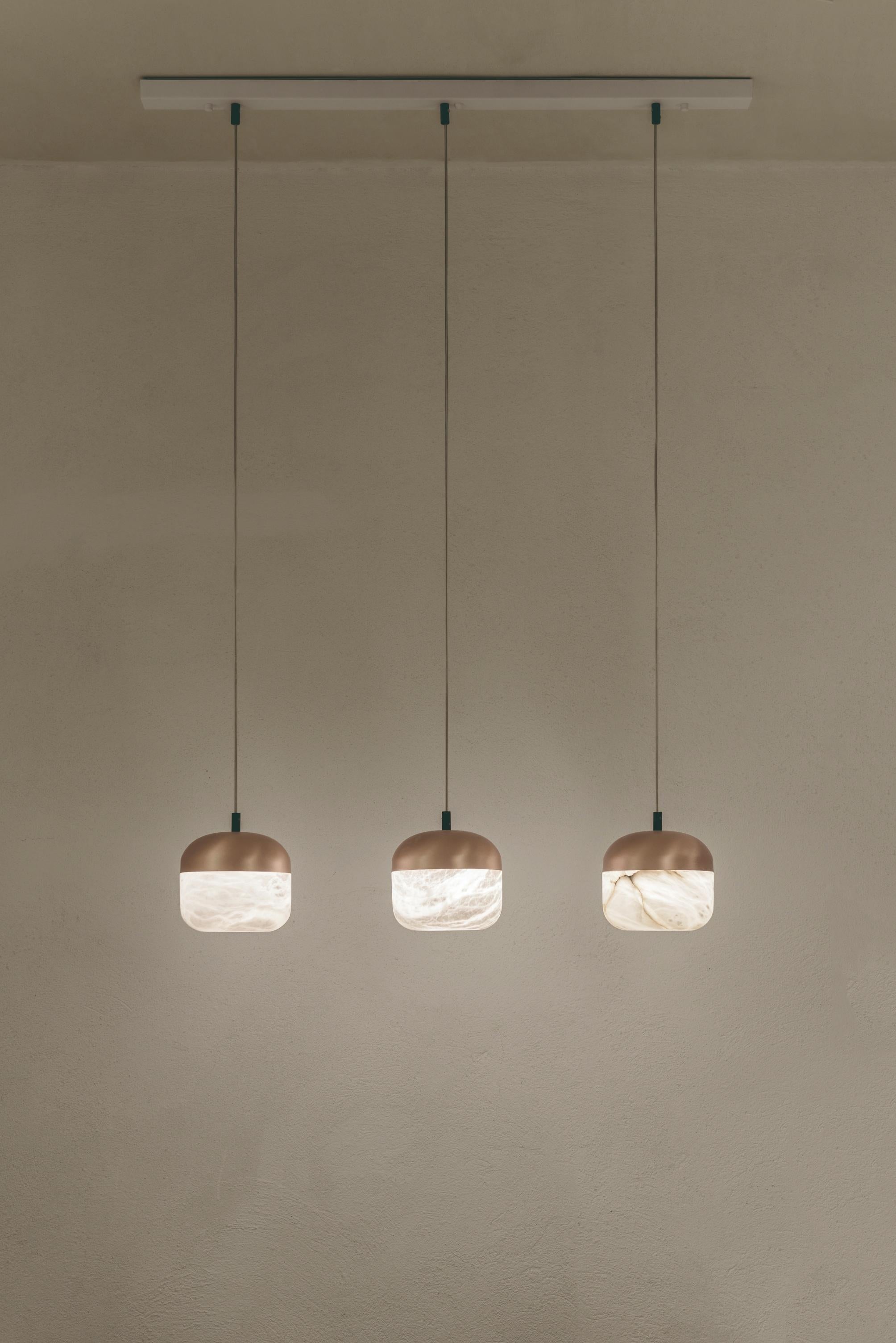 Copper 3 Pendant Lamp by United Alabaster
Dimensions: W 100 x D 18 x H 200 cm
Materials: Alabaster, Copper (Satin Copper Finish)
Also Available: Black Nickel, Satin Gold finishes.

All our lamps can be wired according to each country. If sold to the