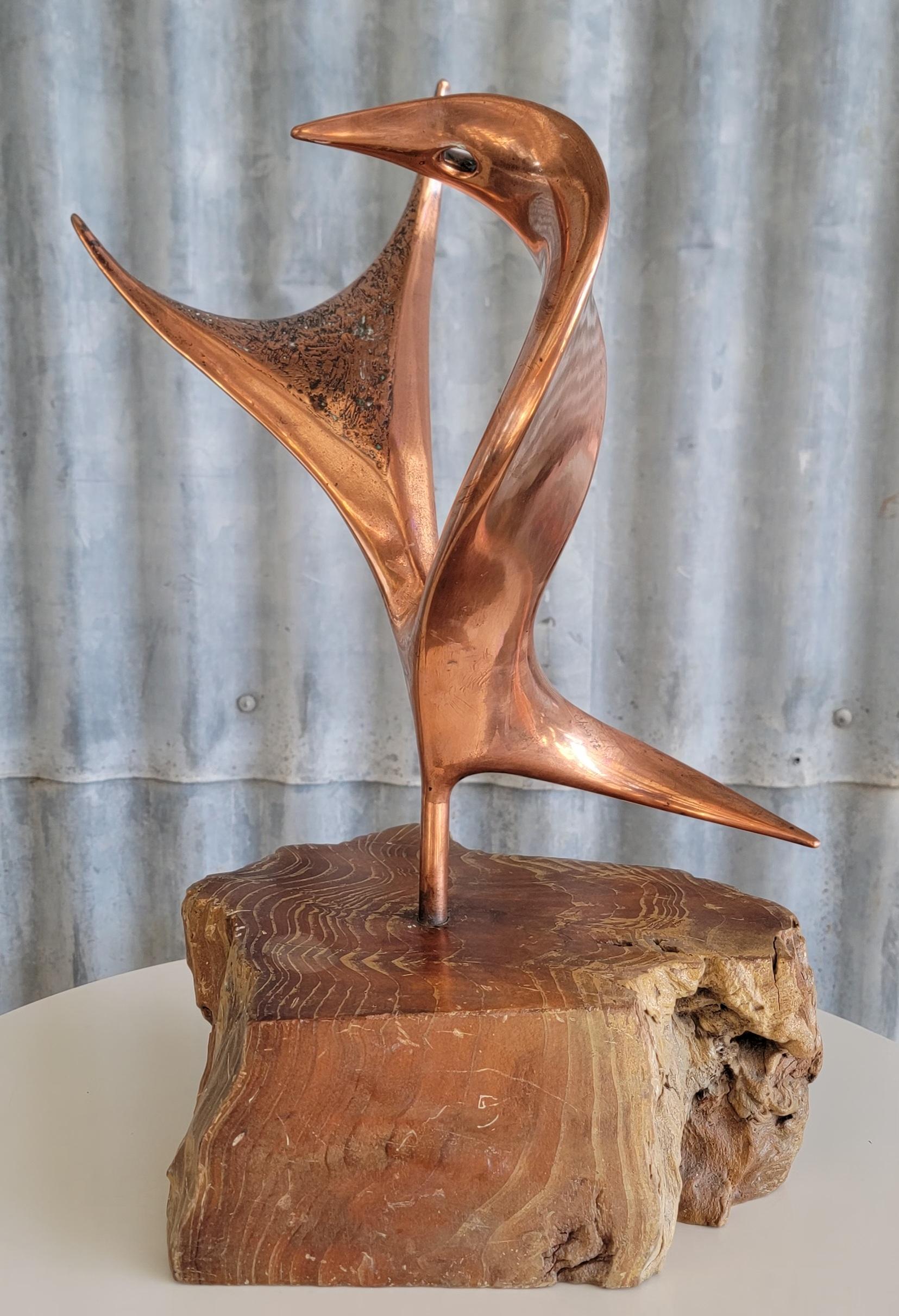 Free-form copper sculpture mounted to a live edge wood base. 