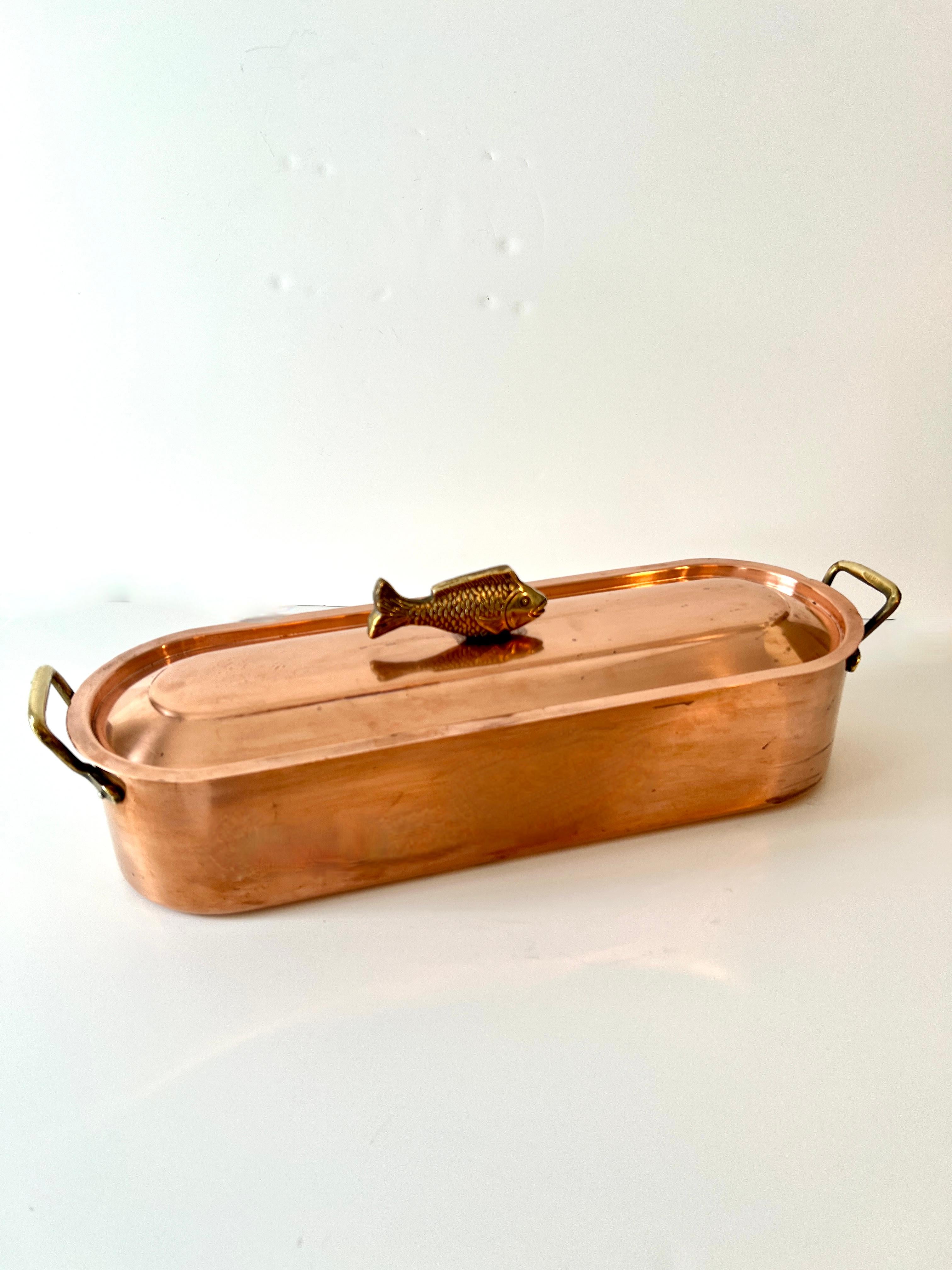 A Copper fish Poacher with Stainless interior removable Rack for your favorite Fish!  The tops removable lid, has a decorative 3-d Fish handle.

A compliment to the kitchen as a practical and functional piece, however just as beautiful as a