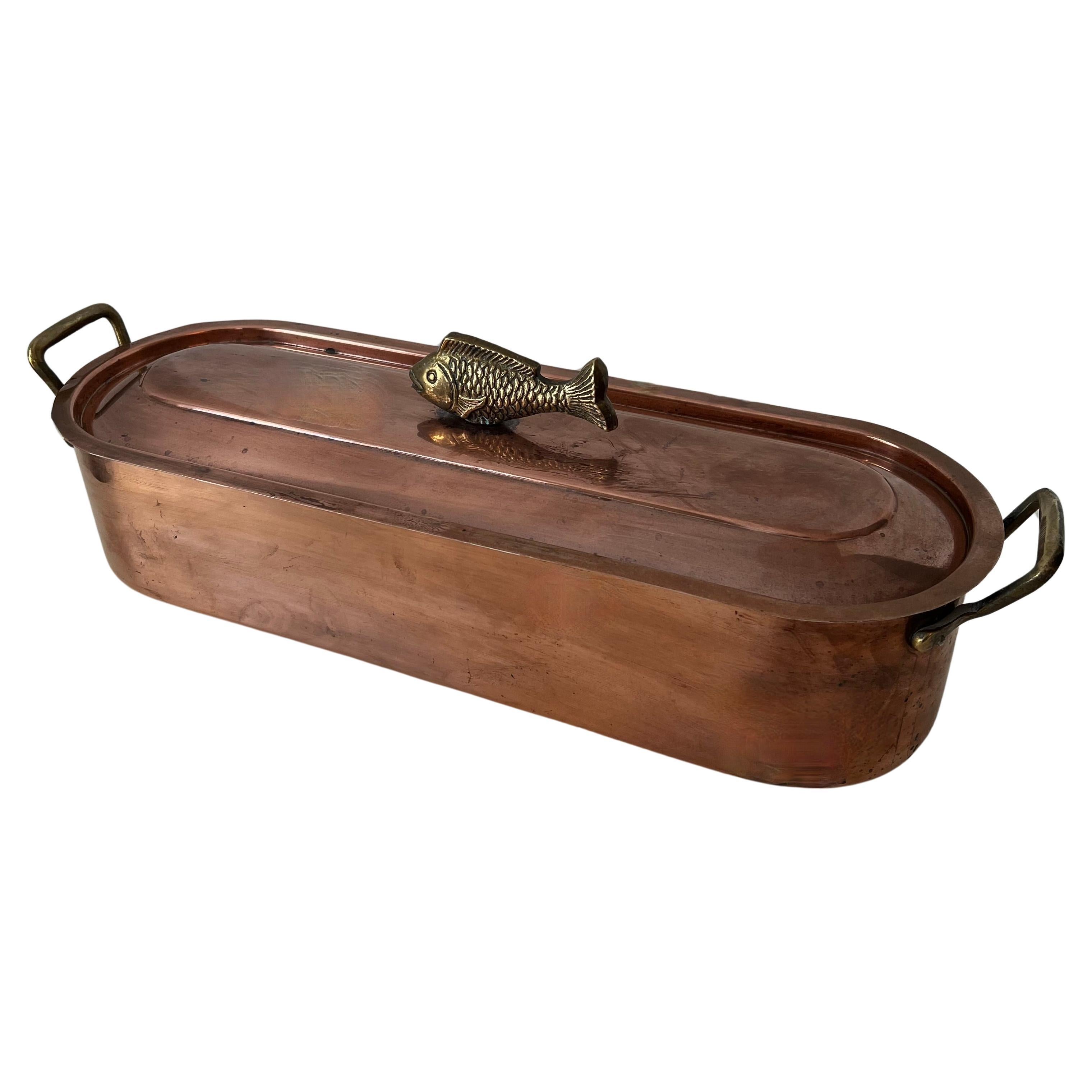 A Copper fish Poacher with Stainless interior removable Rack for your favorite Fish!  The tops removable lid, has a decorative 3-d Fish handle.

A compliment to the kitchen as a practical and functional piece, however just as beautiful as a