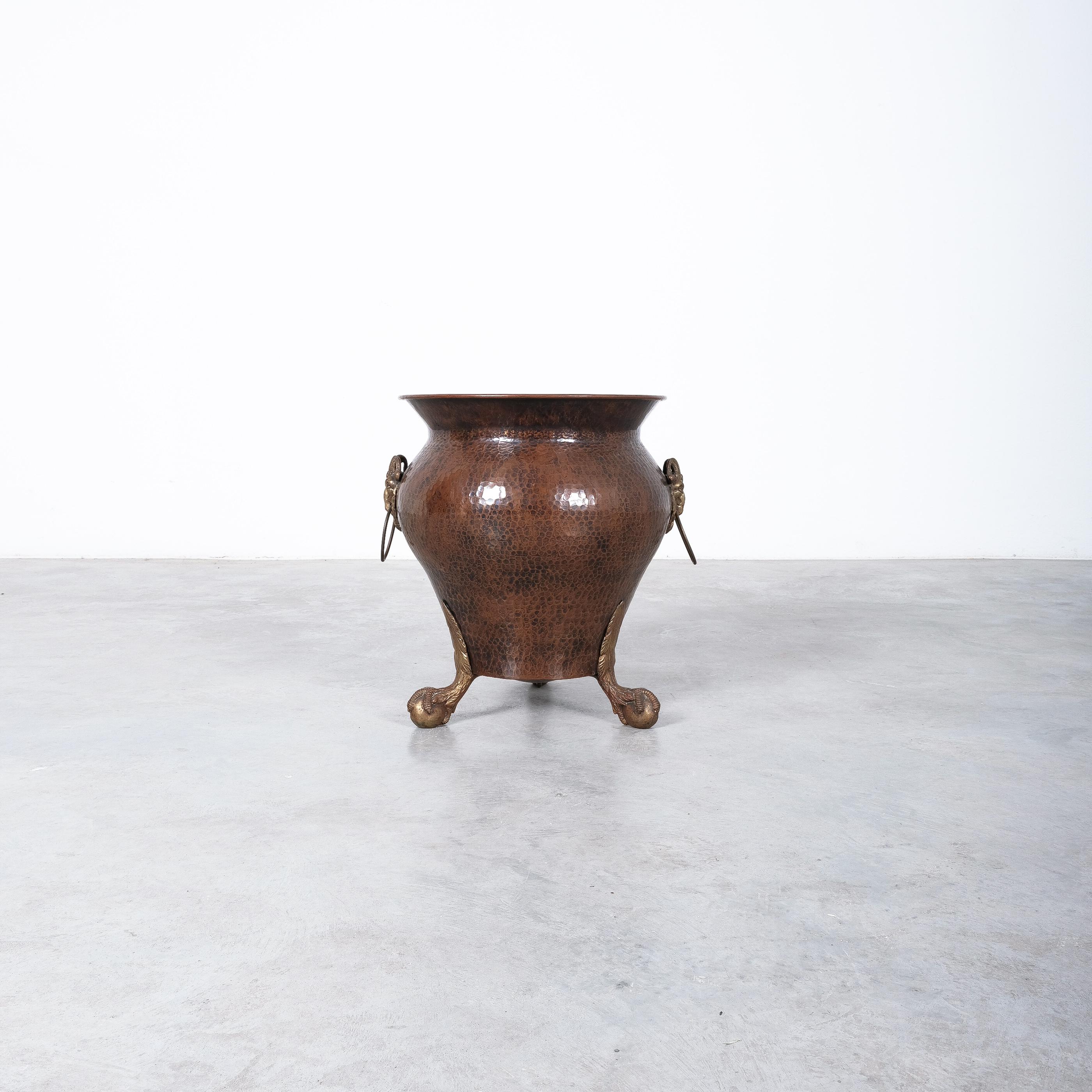 Maudoux Dinant (labelled) large hammered copper & brass planter, Belgium mid-century modern

Extravagant large artisan pot or planter handmade from hammered copper with cast brass details. Whether you're an interior designer, collector of vintage
