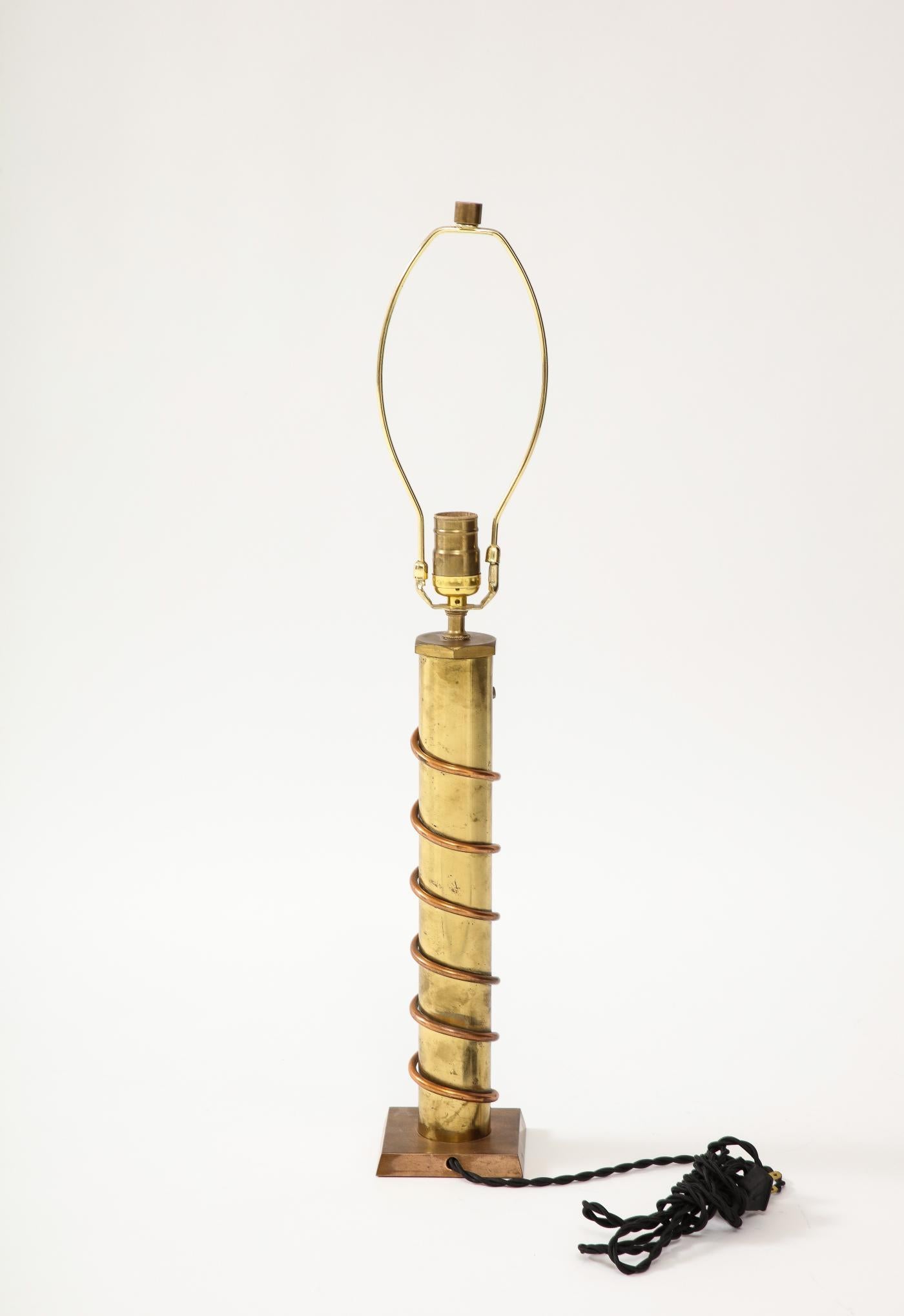 Copper and Brass Table Lamp, France, c. 1940

Playful copper and brass table lamp; beautifully patinated.
Newly rewired with a black twisted-silk cord.


